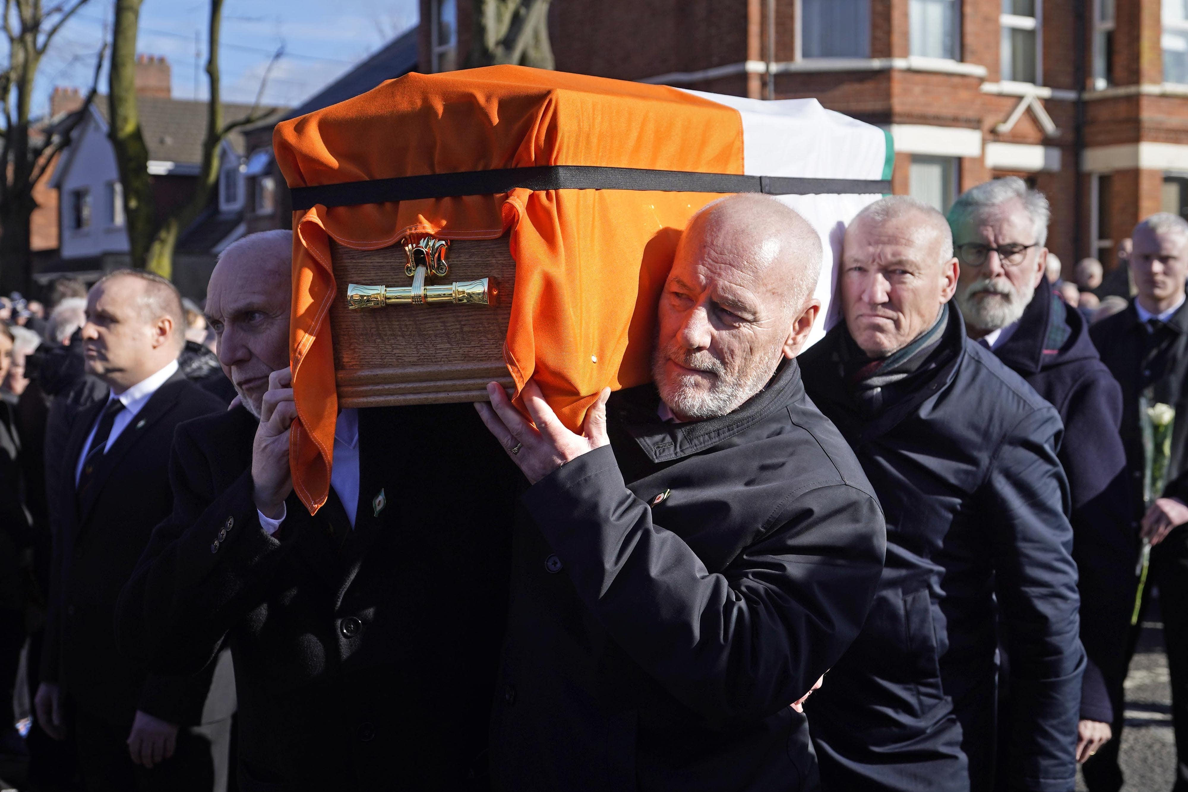 Former Sinn Fein president Gerry Adams (right) walks behind the coffin of Brendan ‘Bik’ McFarlane as it leaves his family home on Cliftonville Road, Belfast (Niall Carson/PA)