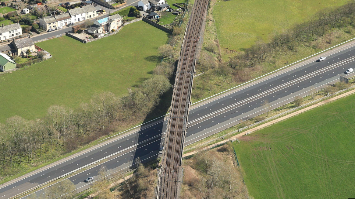 Closing time: Clifton Bridge carrying the West Coast main line over the M6 in Cumbria – both links will close in January 2026