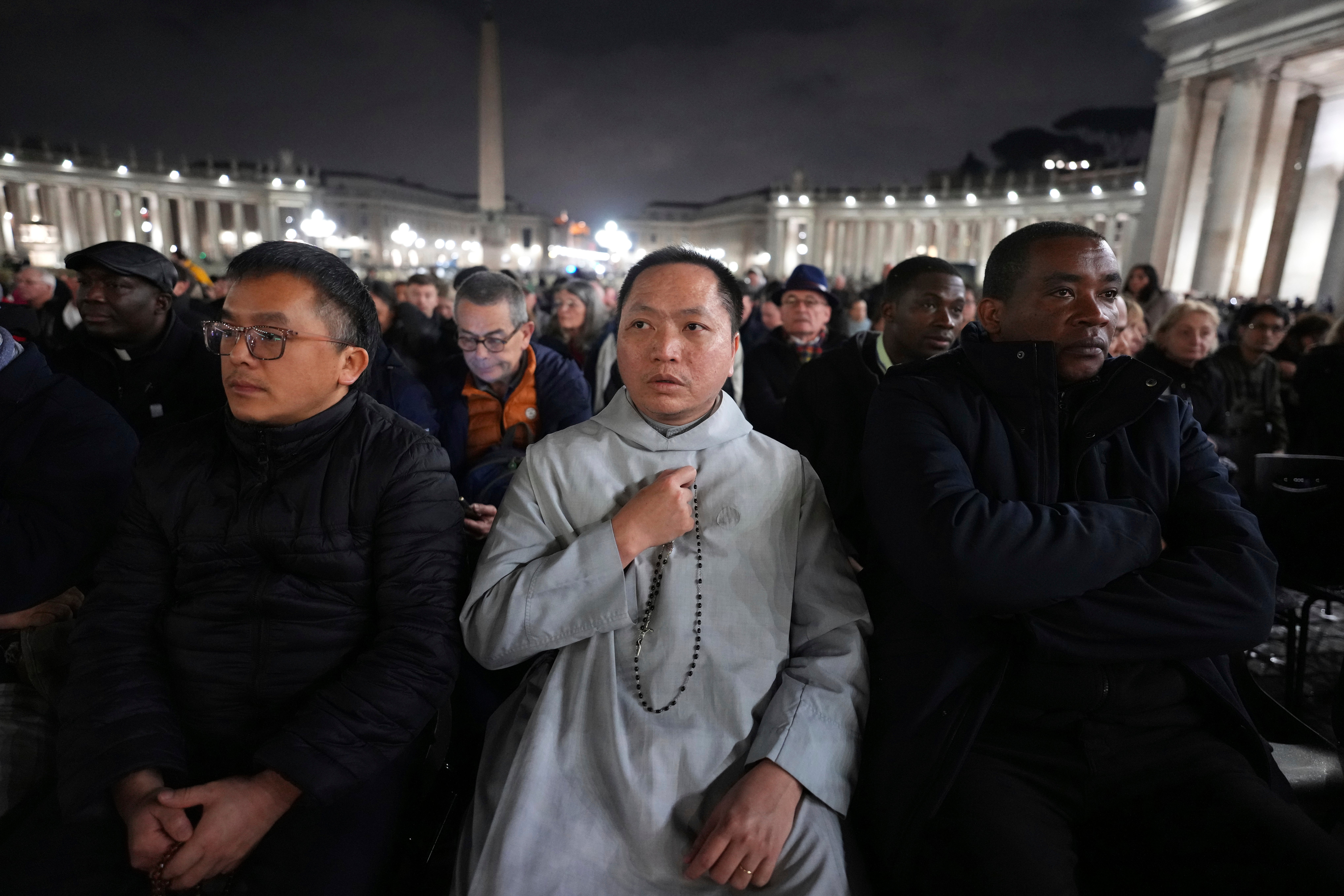 People attend a rosary prayer service with Tagle for the health of Pope Francis in St Peter’s Square, 25 February