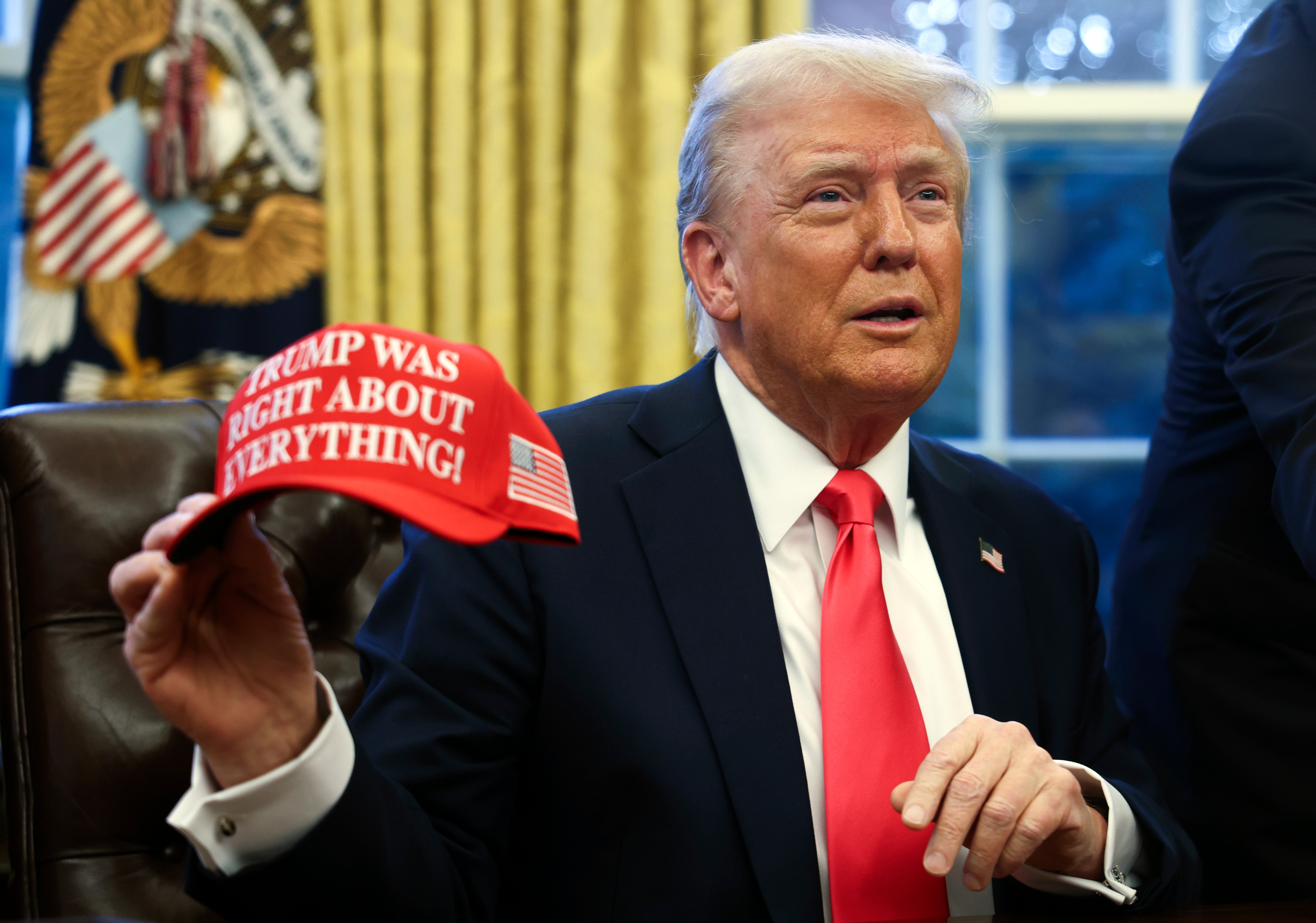 Trump shows off a new hat that reads, ‘TRUMP WAS RIGHT ABOUT EVERYTHING!’