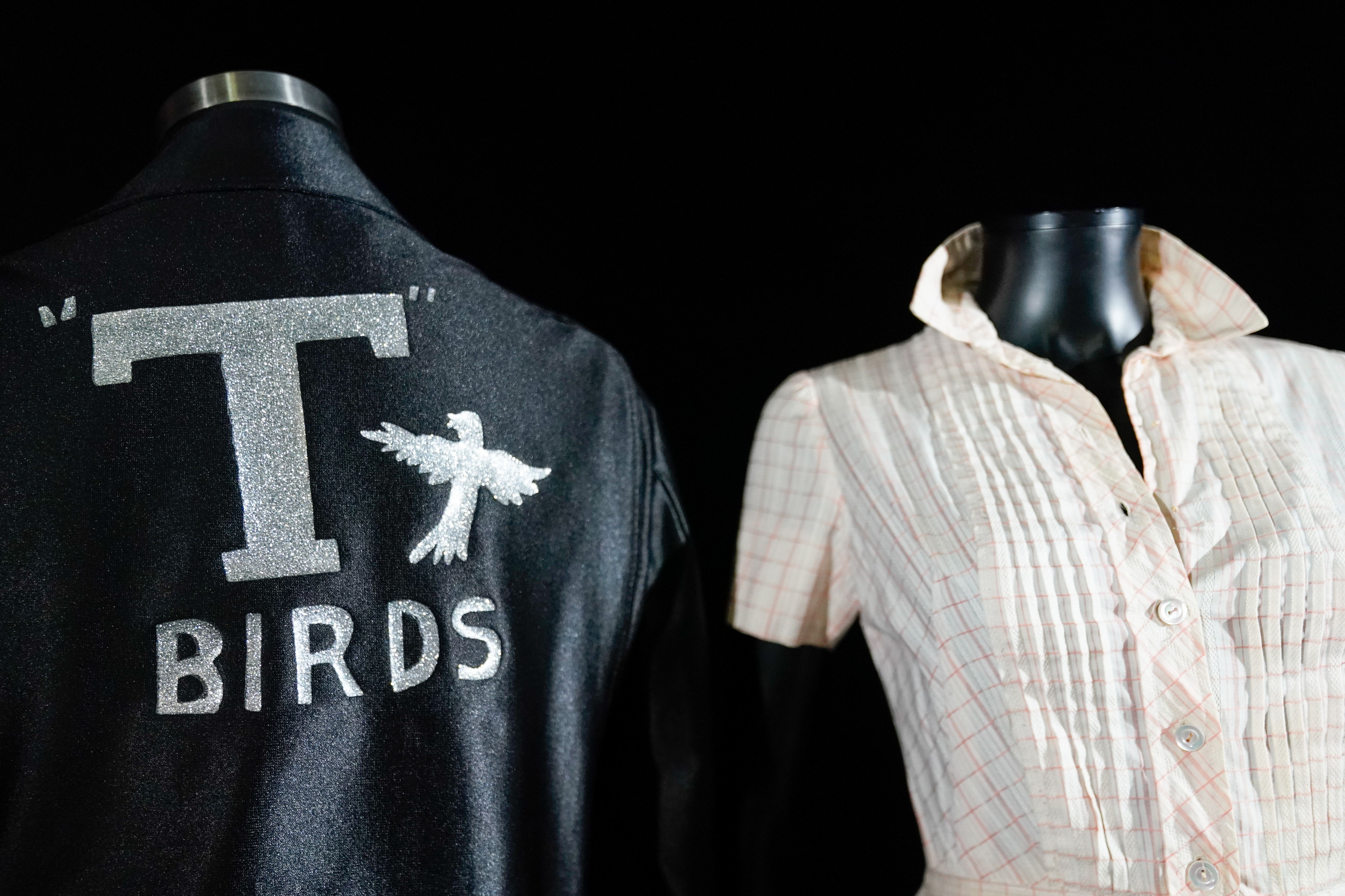 Outfits worn by John Travolta and Dame Olivia Newton-John in the film Grease are among the items going on sale in a memorabilia auction in Los Angeles in March (Andrew Matthews/PA)