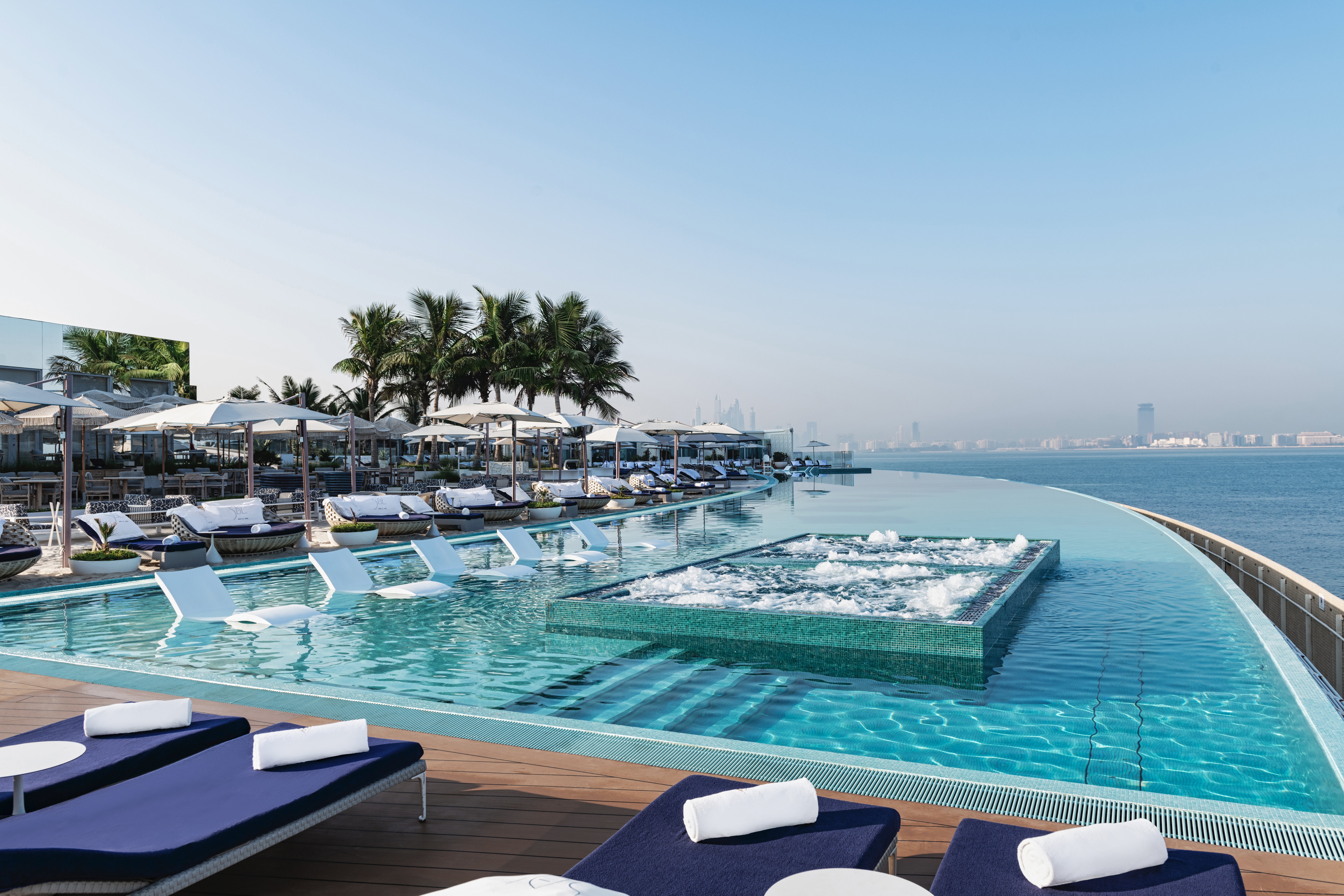 The infinity pool offers exceptional views across the bay