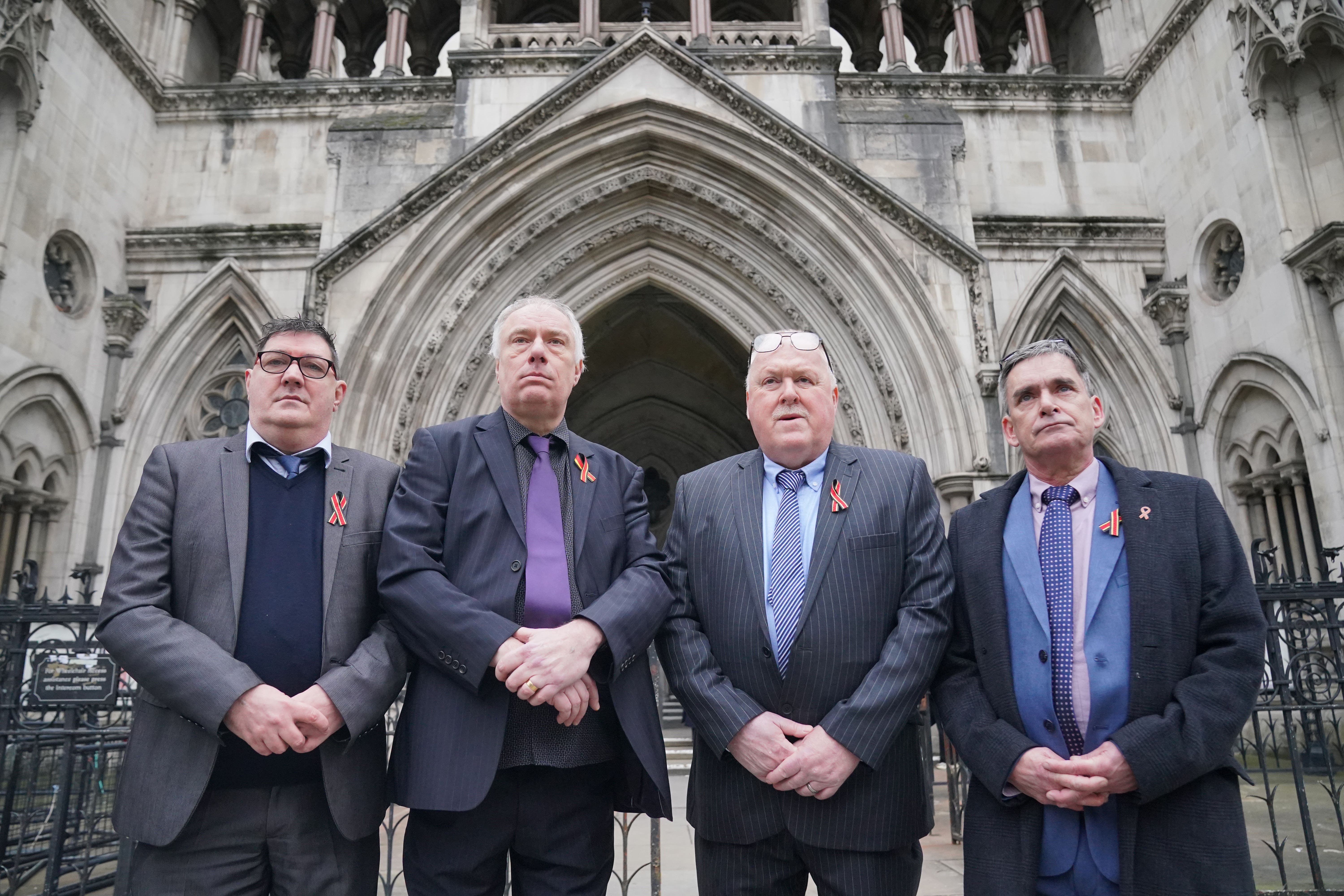Former students of Treloar’s School (left to right) Adrian Goodyear, Richard Warwick, Steve Nicholls, and Gary Webster, outside the Royal Courts of Justice in London (Jonathan Brady/PA)