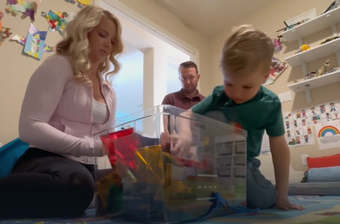 Jill Barnett, and her son, Bryce, playing at their home in Deer Valley, Arizona. Bryce, 5, has been accepted into Mensa after scoring a 145 on an IQ test