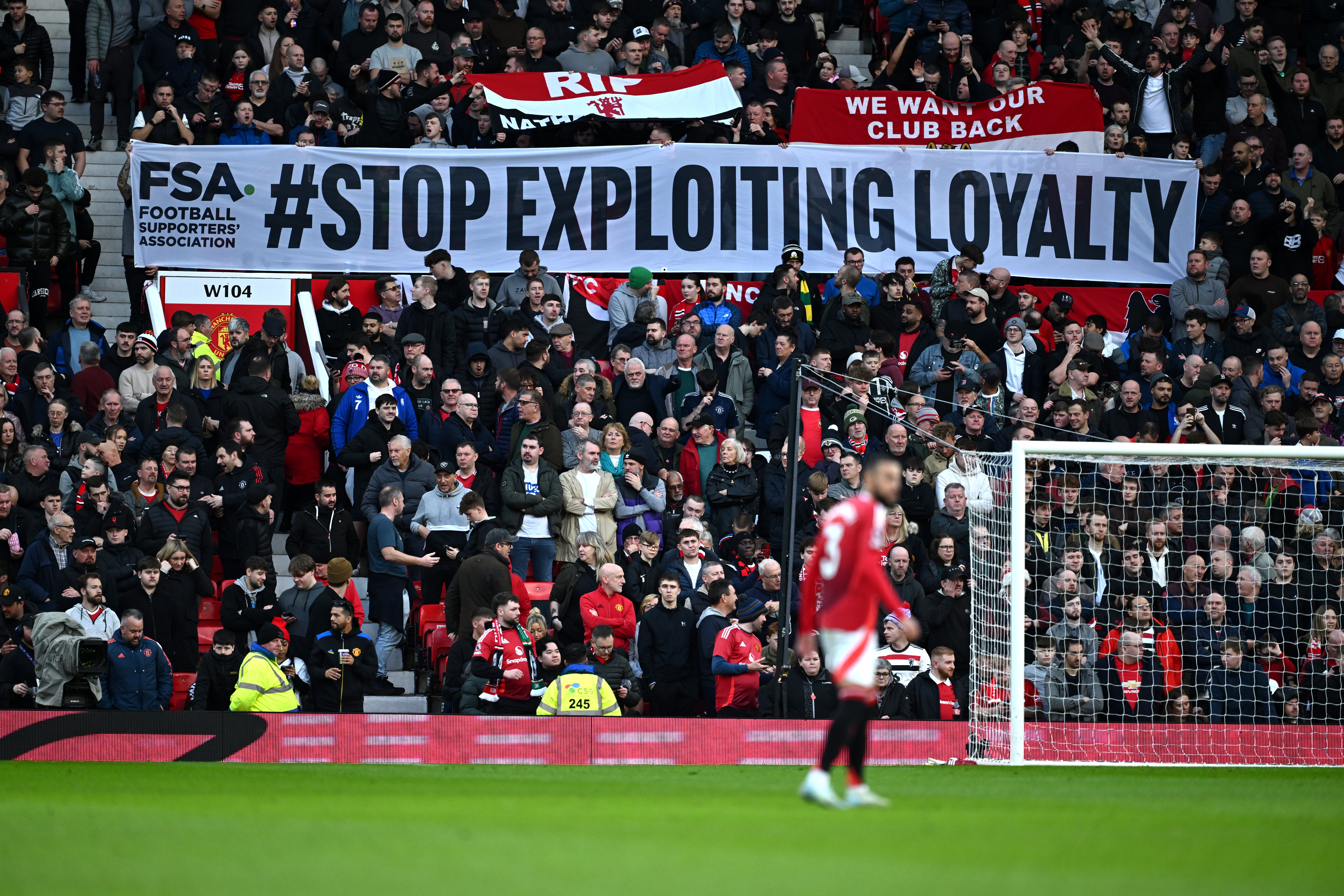 A banner at Old Trafford sends a message to Manchester United's owners