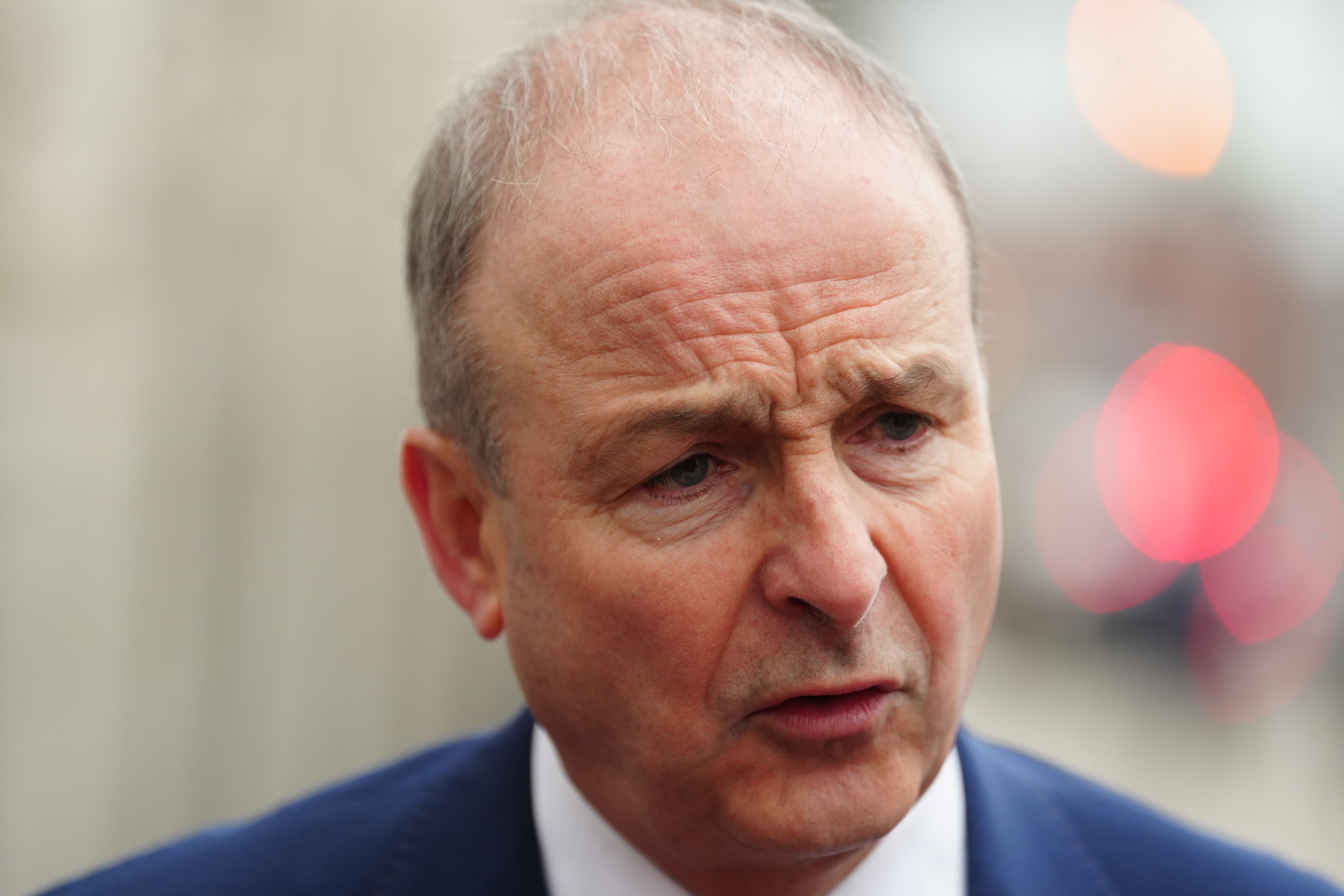 Taoiseach Micheal Martin has cancelled a planned visit to meet political leaders in Northern Ireland on Thursday, over “urgent international business”.