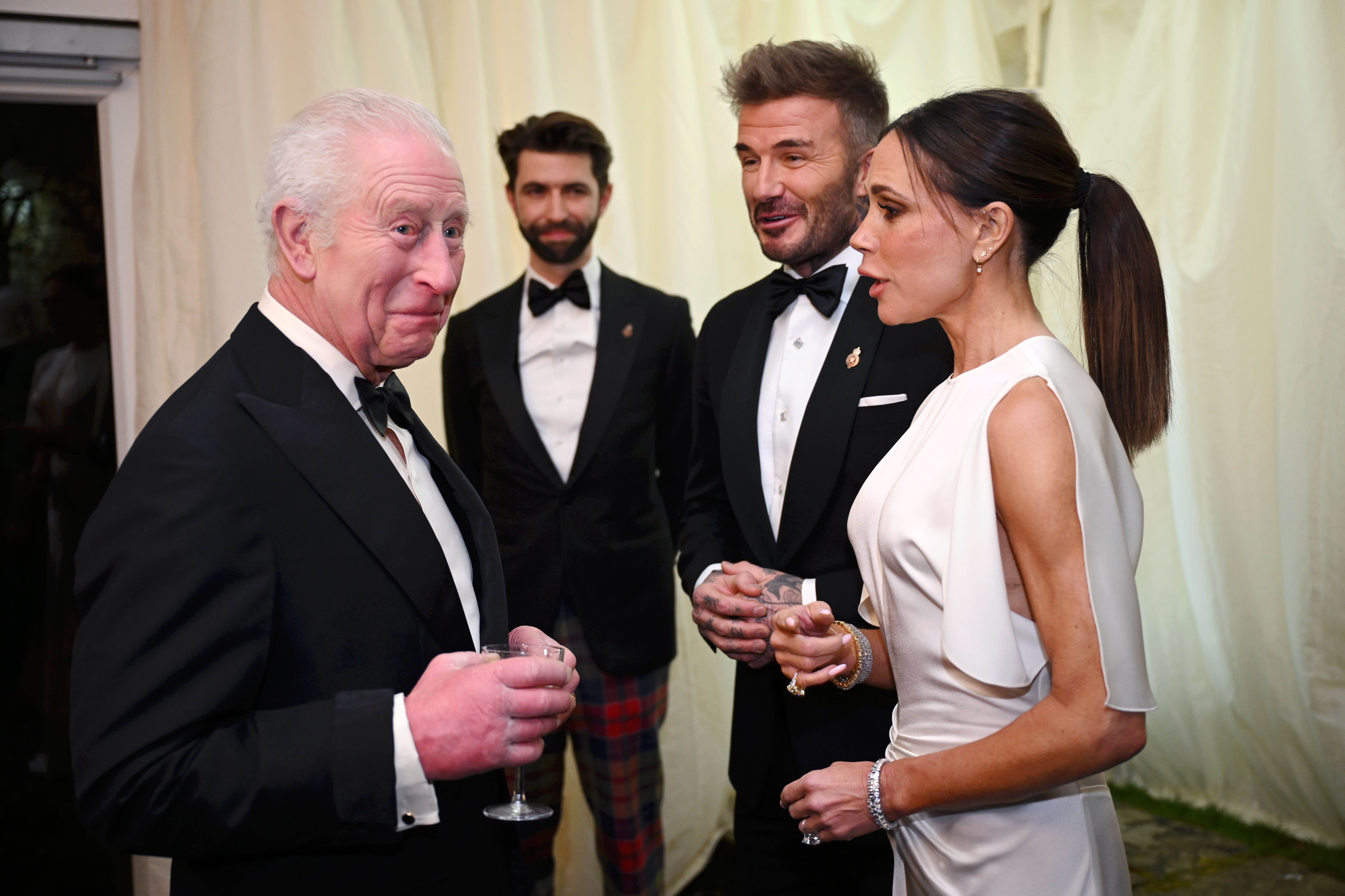 The King speaks to David Beckham and Beckham (PA)