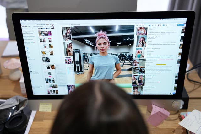 <p>File. The Clueless agency creative director Diana Nunez works on an AI image of model Aitana Lopez in Barcelona, Spain, on 25 March 2024</p>