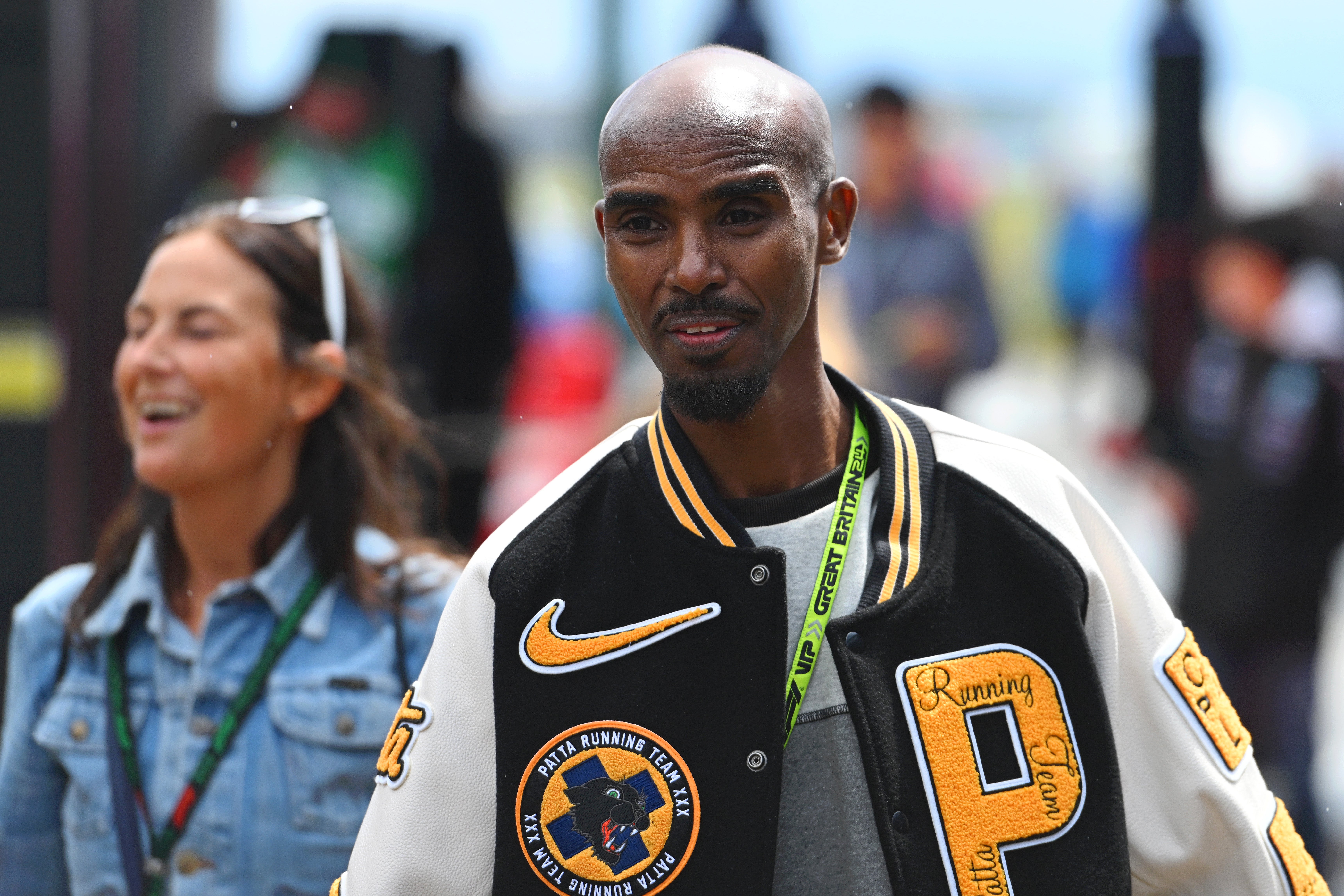 Mo Farah walks the Paddock at Silverstone, where he hopes to host a RunGP event