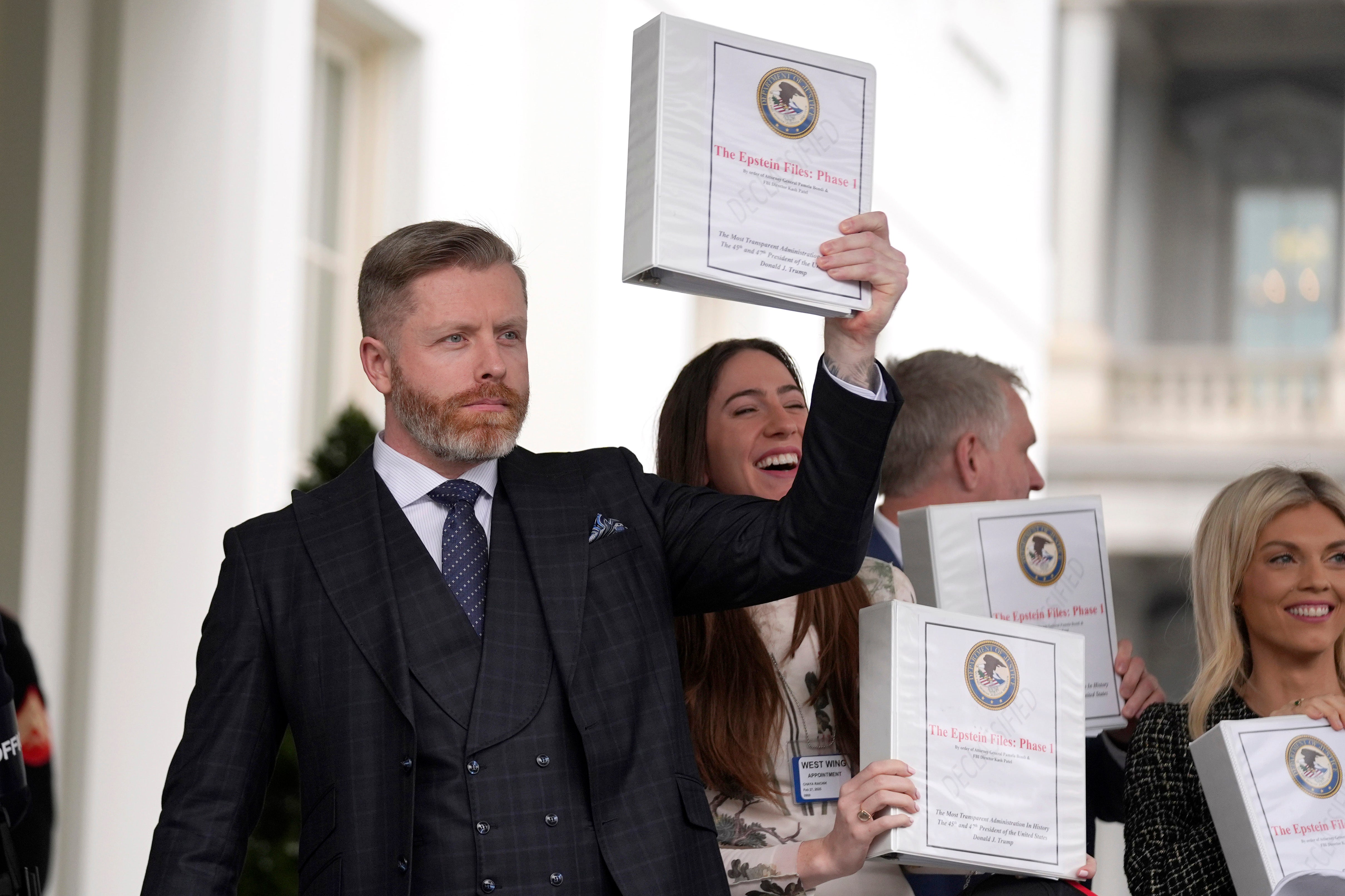 MAGA influencers paraded their ‘Epstein files’ binders on Thursday outside the White House