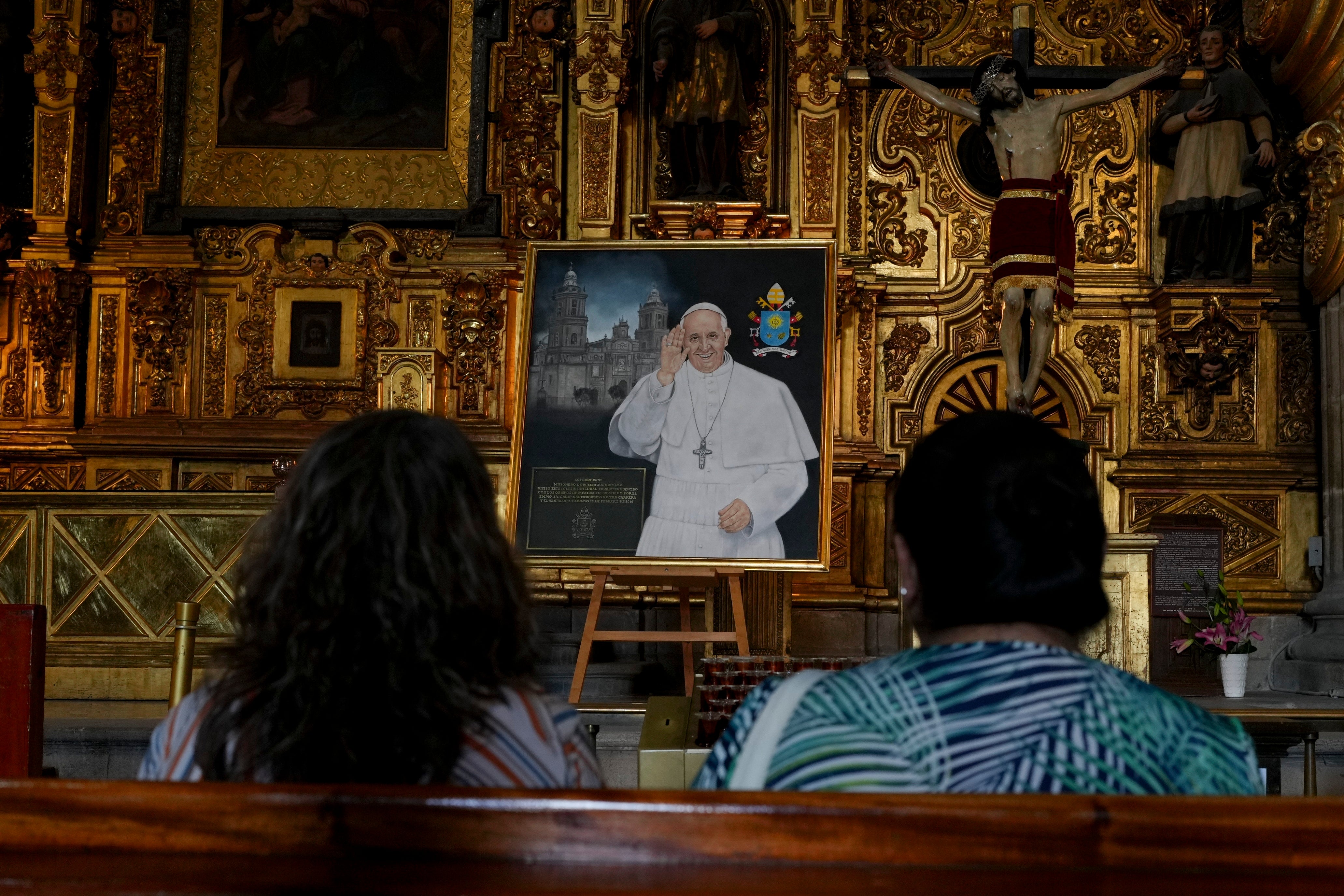 Parishioners pray for the health of Pope Francis at the Metropolitan Cathedral in Mexico City