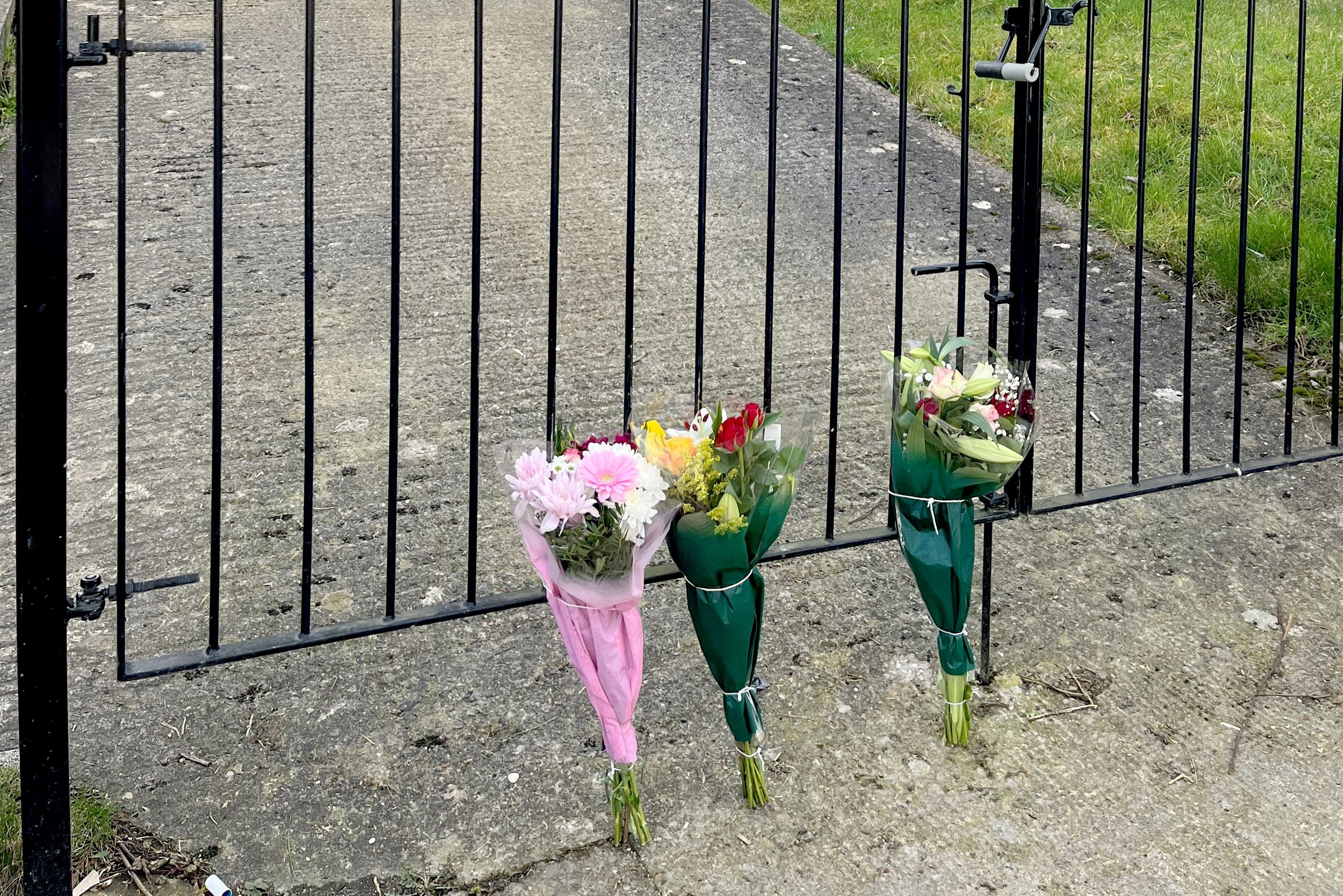 Flowers have been left outside the flat (Rod Minchin/PA)