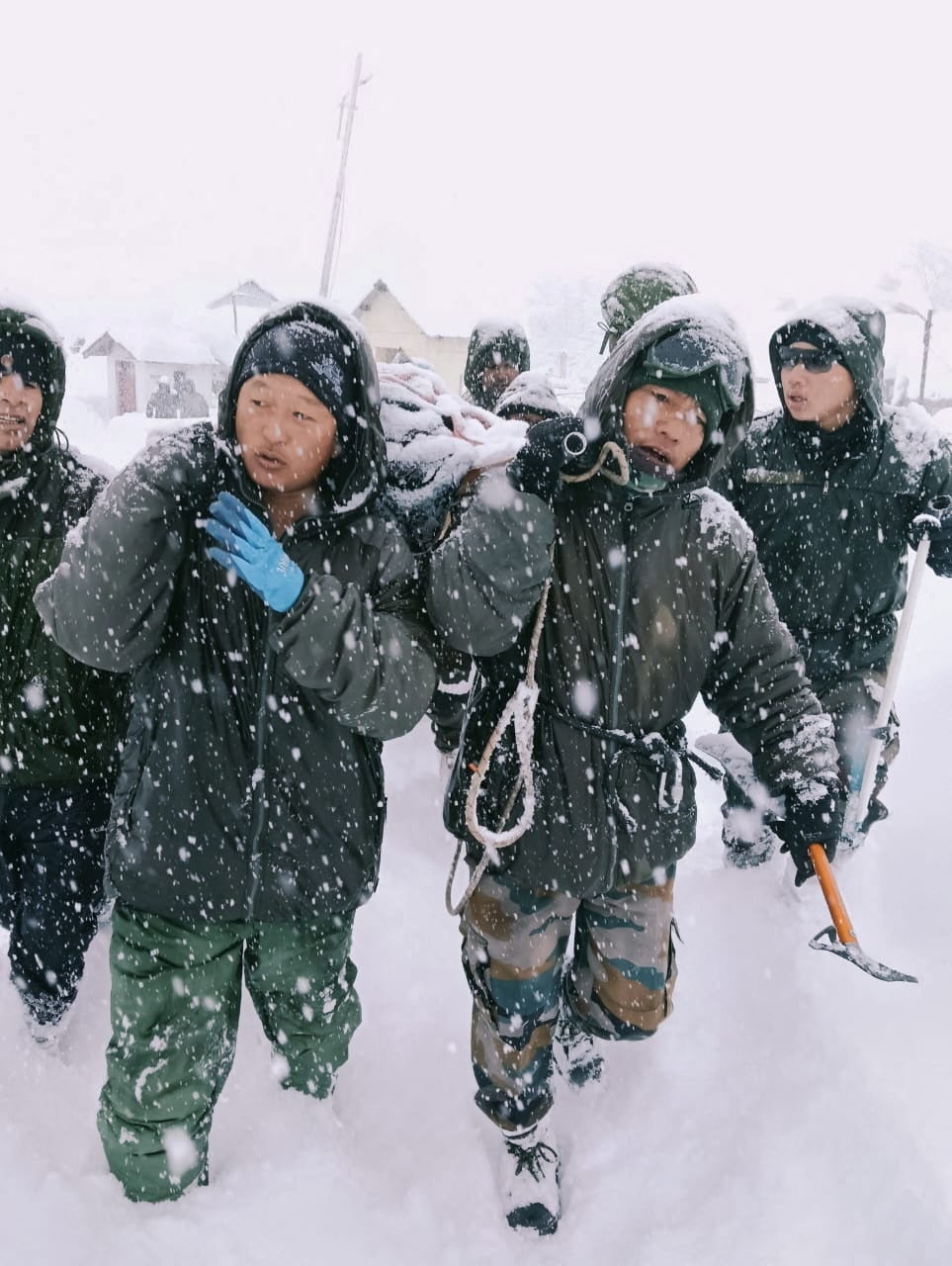Indian army soldiers helping in the rescue effort after the avalanche in Uttarakhand