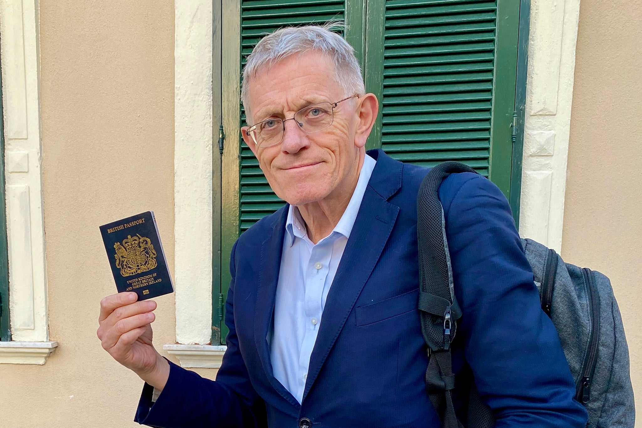 Simon Calder holding his passport