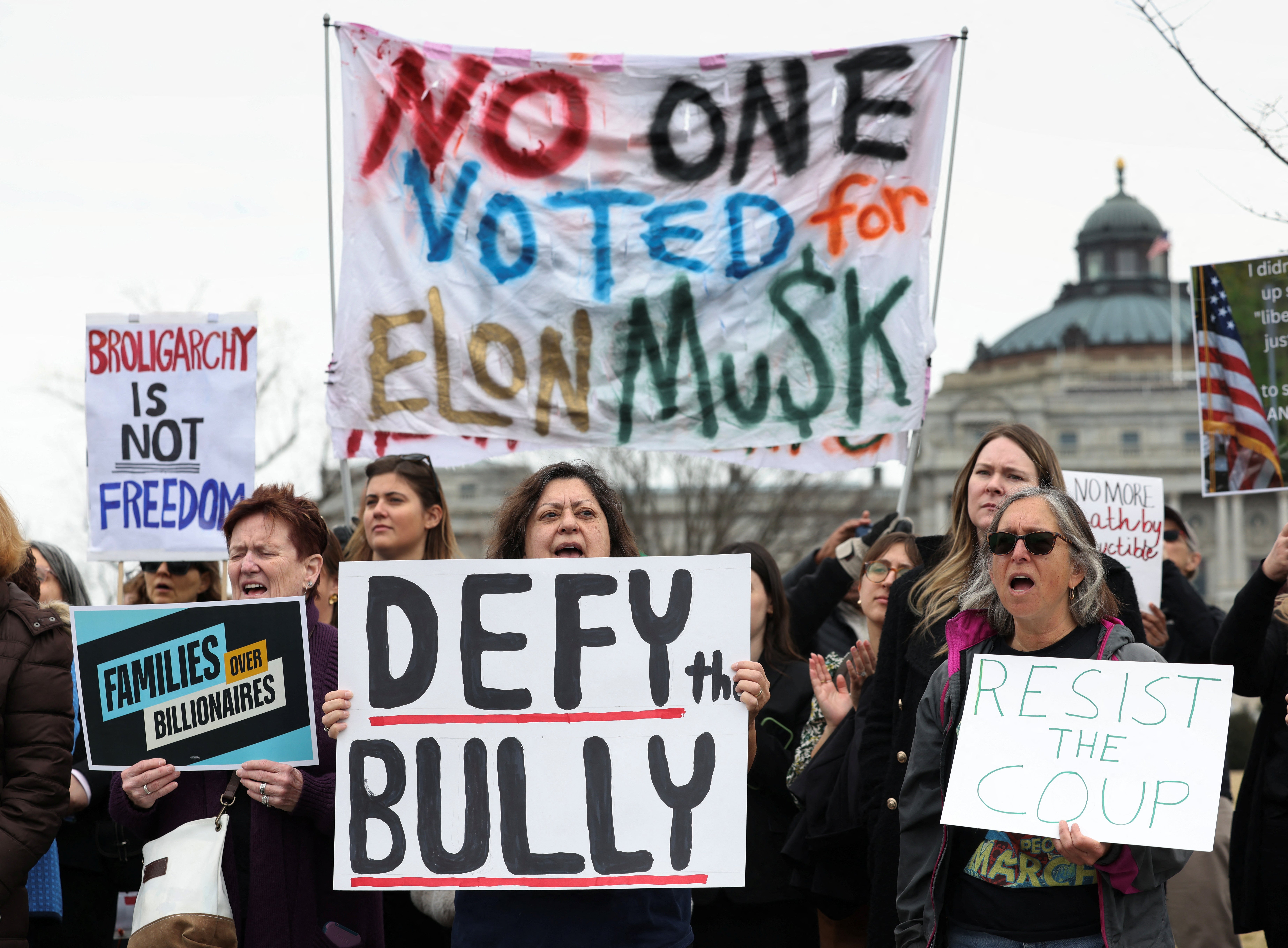 Demonstrators protest against Donald Trump and Elon Musk in Washington, D.C., on February 25