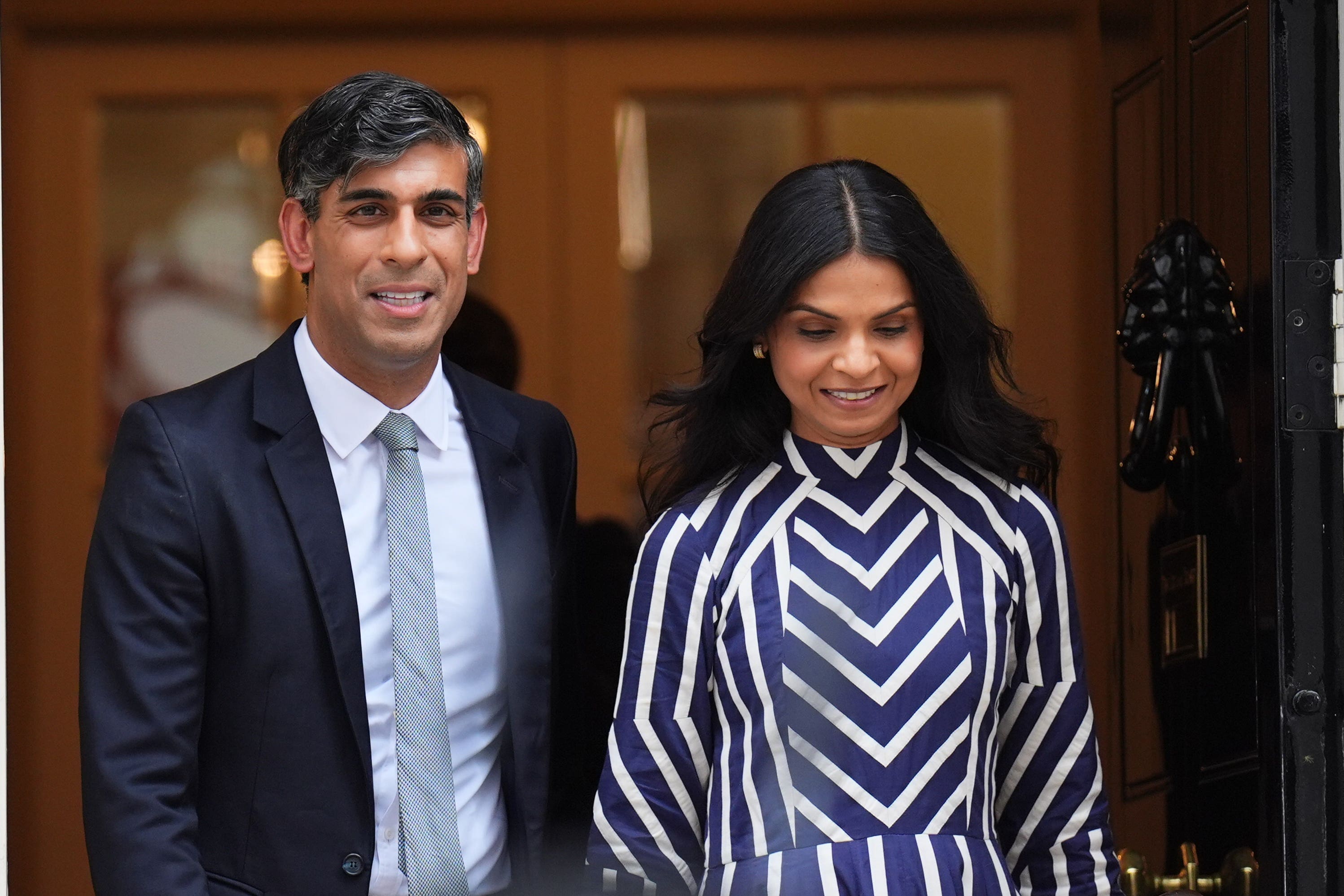 Rishi Sunak with his wife Akshata Murty (James Manning/PA)