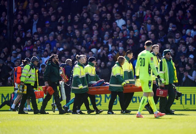 <p>Jean-Philippe Mateta is carried off the field on a stretcher for treatment</p>