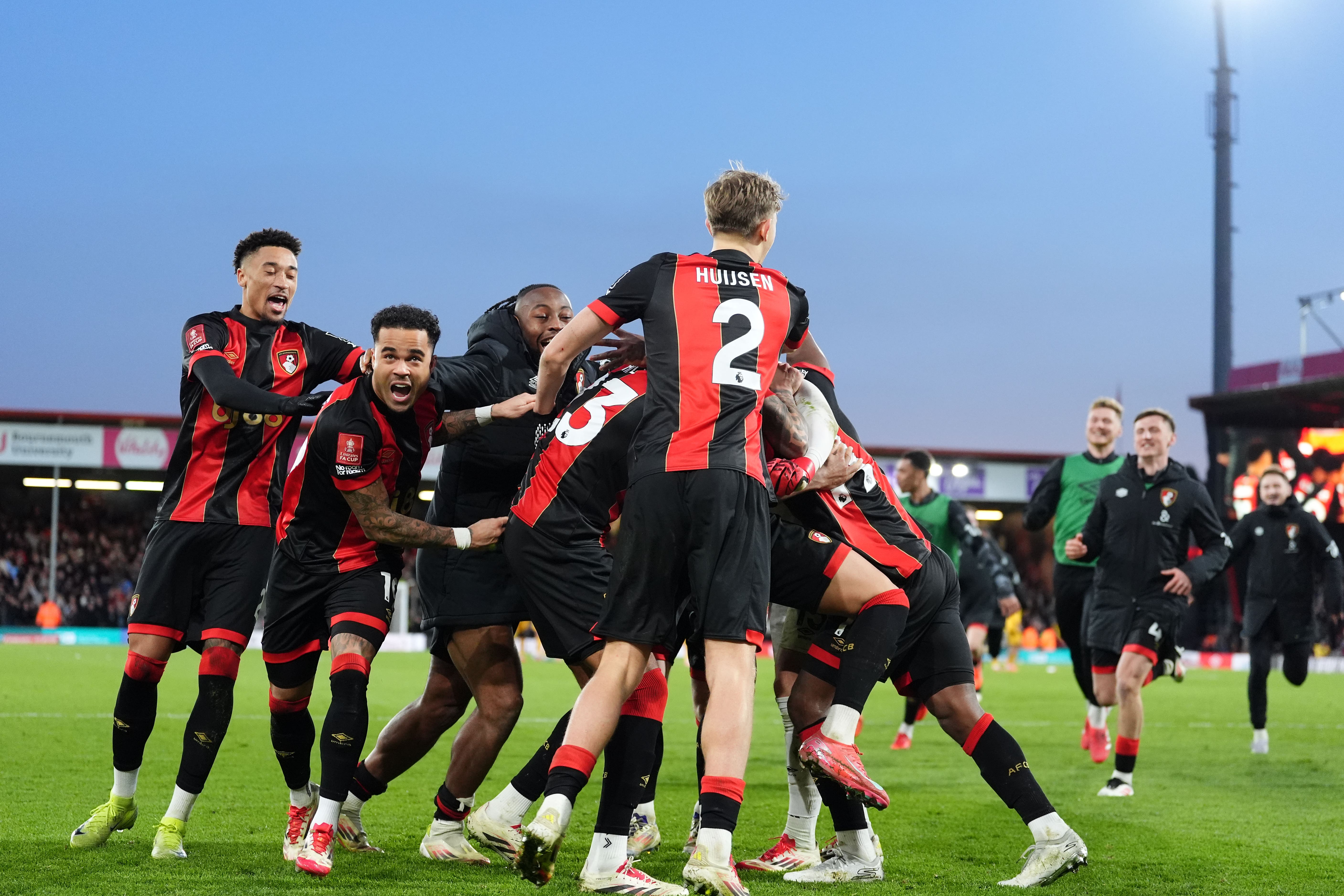 Bournemouth players celebrate winning the penalty shoot-out (Adam Davy/PA)