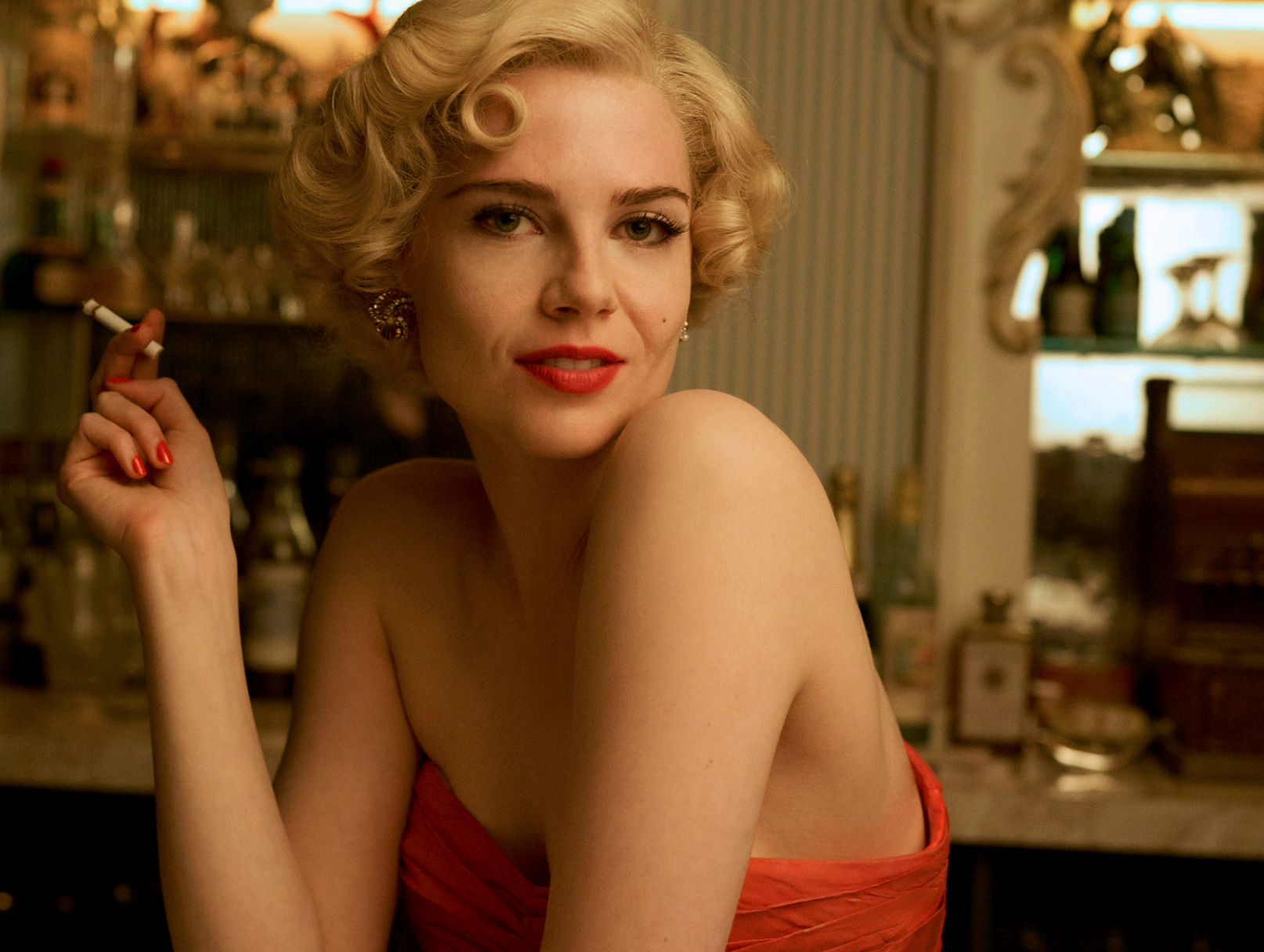 Lucy Boynton portrays the doomed hostess in the new series
