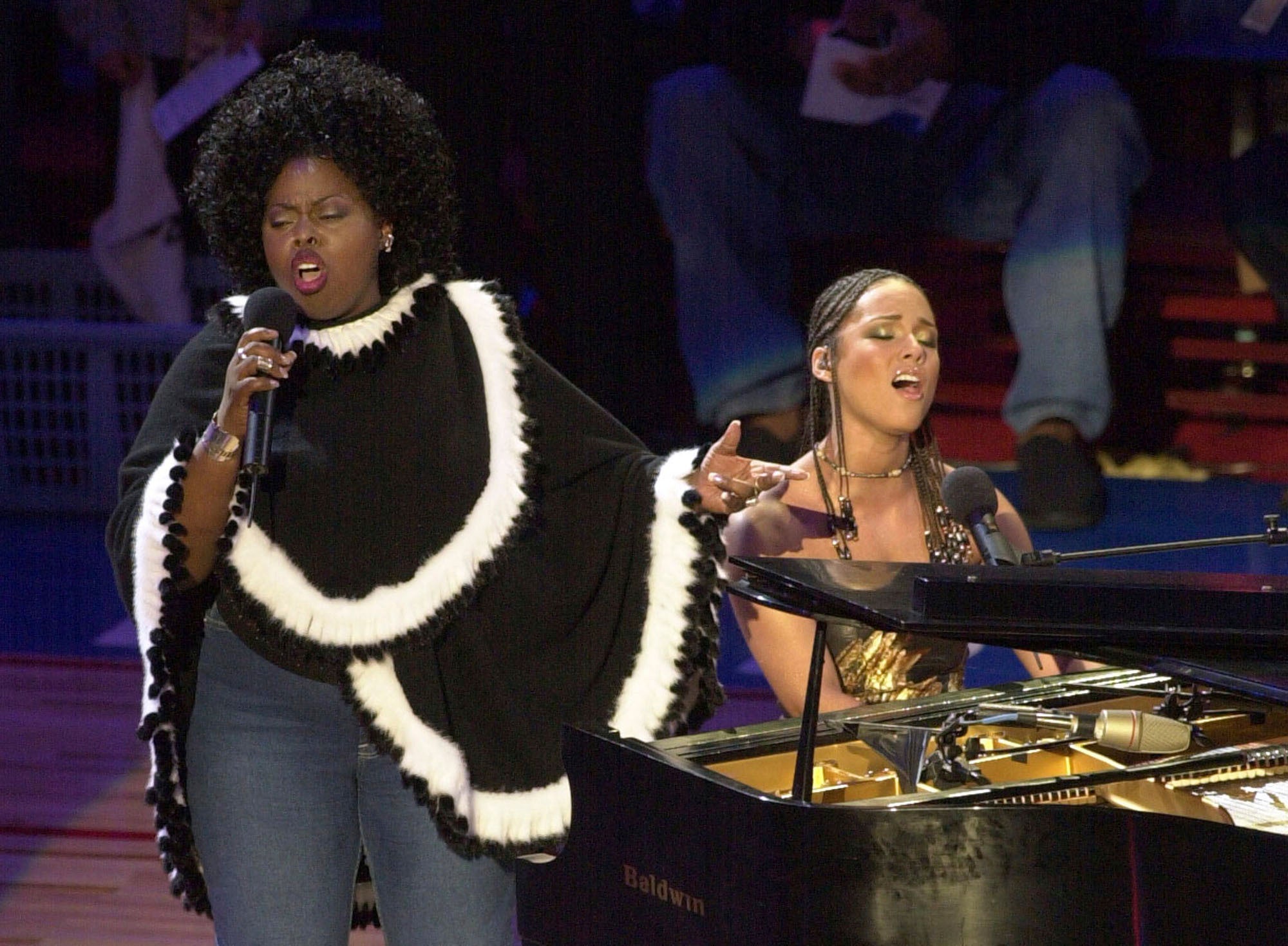 Alicia Keys, right, and Angie Stone perform in 2002