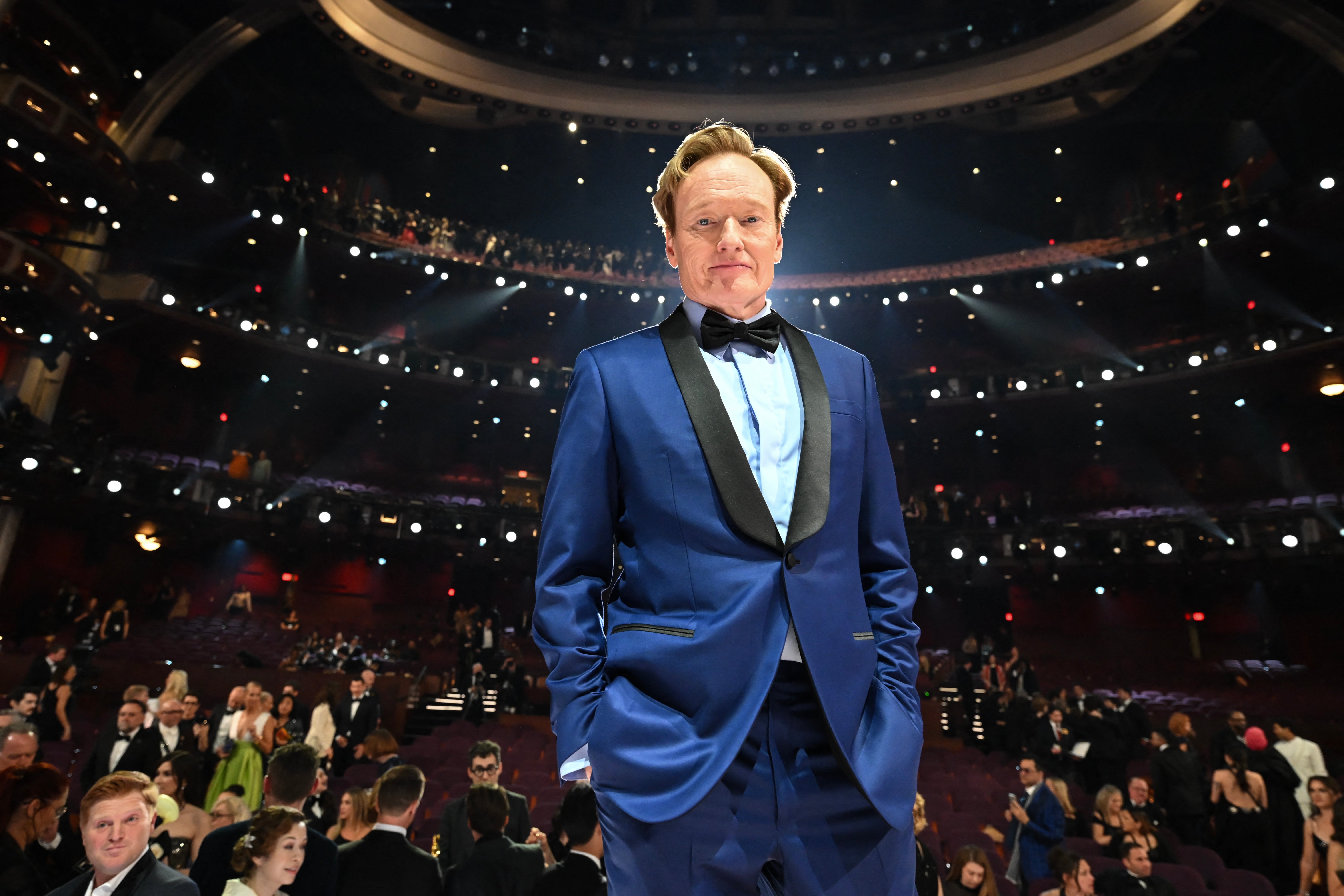 Conan O’Brien, seen here hosting the Oscars in 2025, has generally steered clear of politics during his career