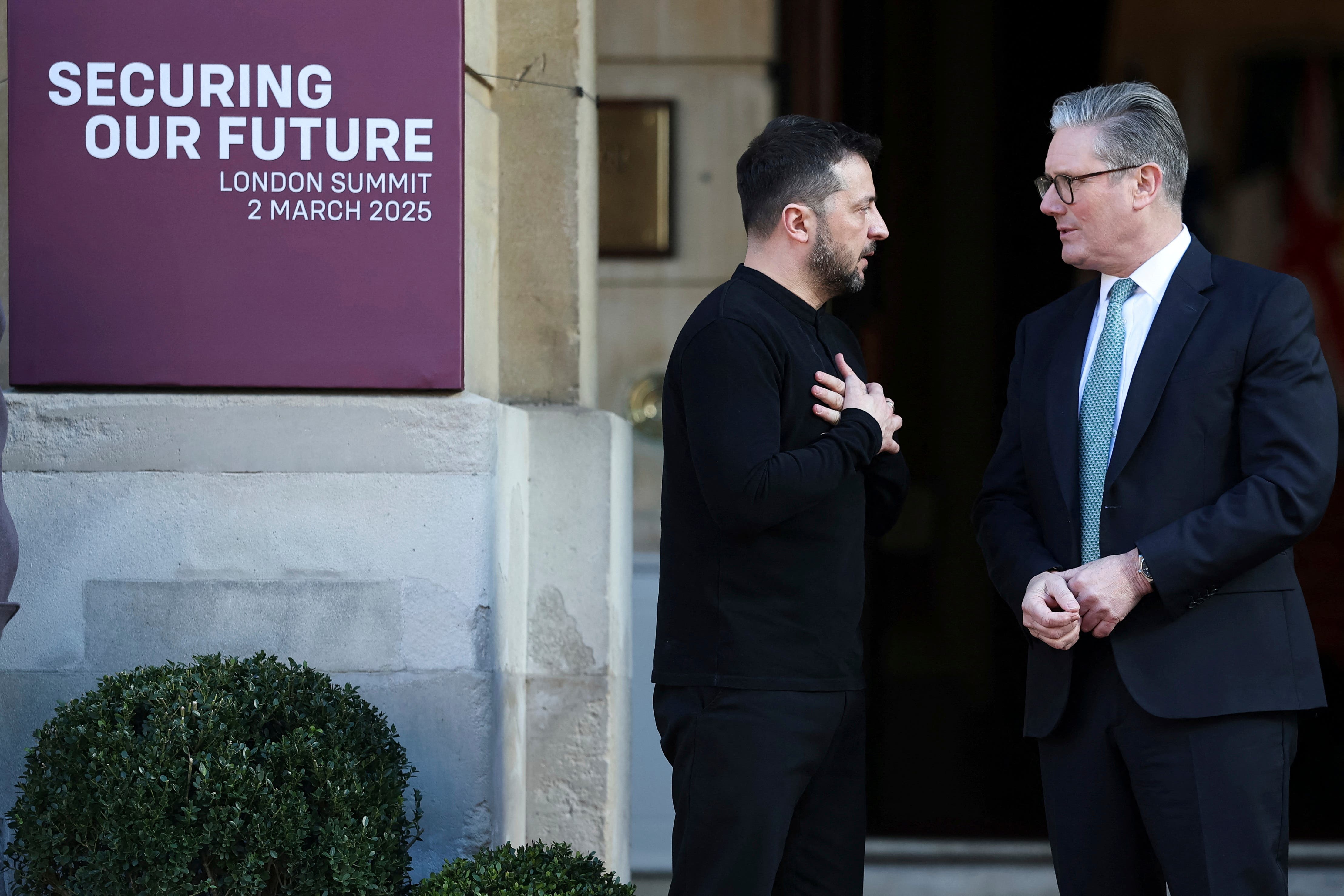 Britain’s Prime Minister Keir Starmer, right, welcomes Ukrainian President Volodymyr Zelensky to the European leaders’ summit to discuss Ukraine, at Lancaster House, London (Toby Melville/Pool via AP)