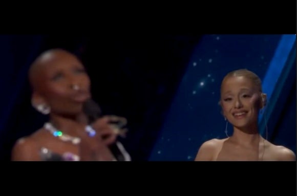 Ariana Grande lovingly looks at Cynthia Erivo during the Oscars’ opening