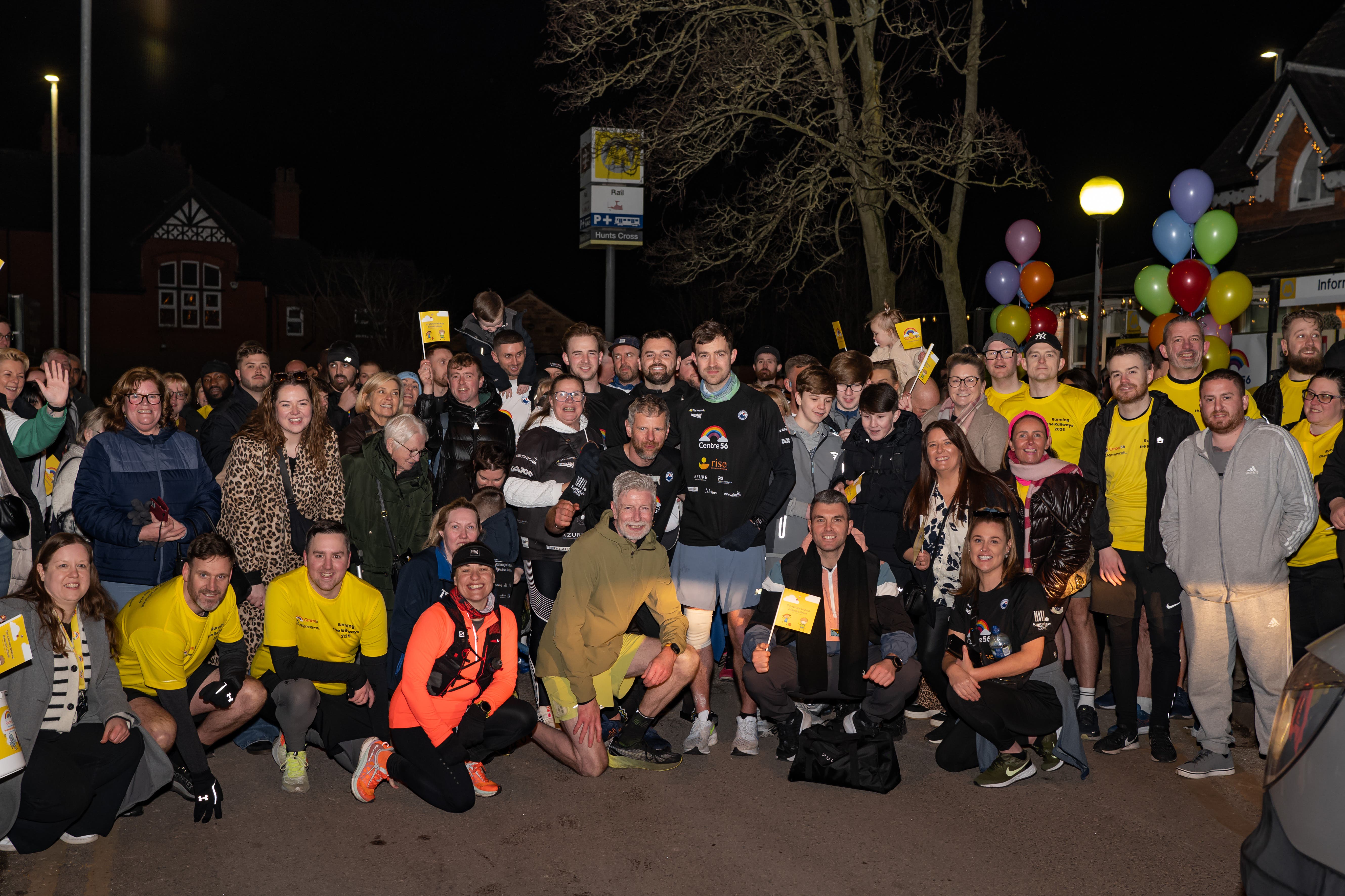 Alex Rigby (centre) with supporters at the end of his charity run to each station on the Merseyrail network (Merseyrail/PA)