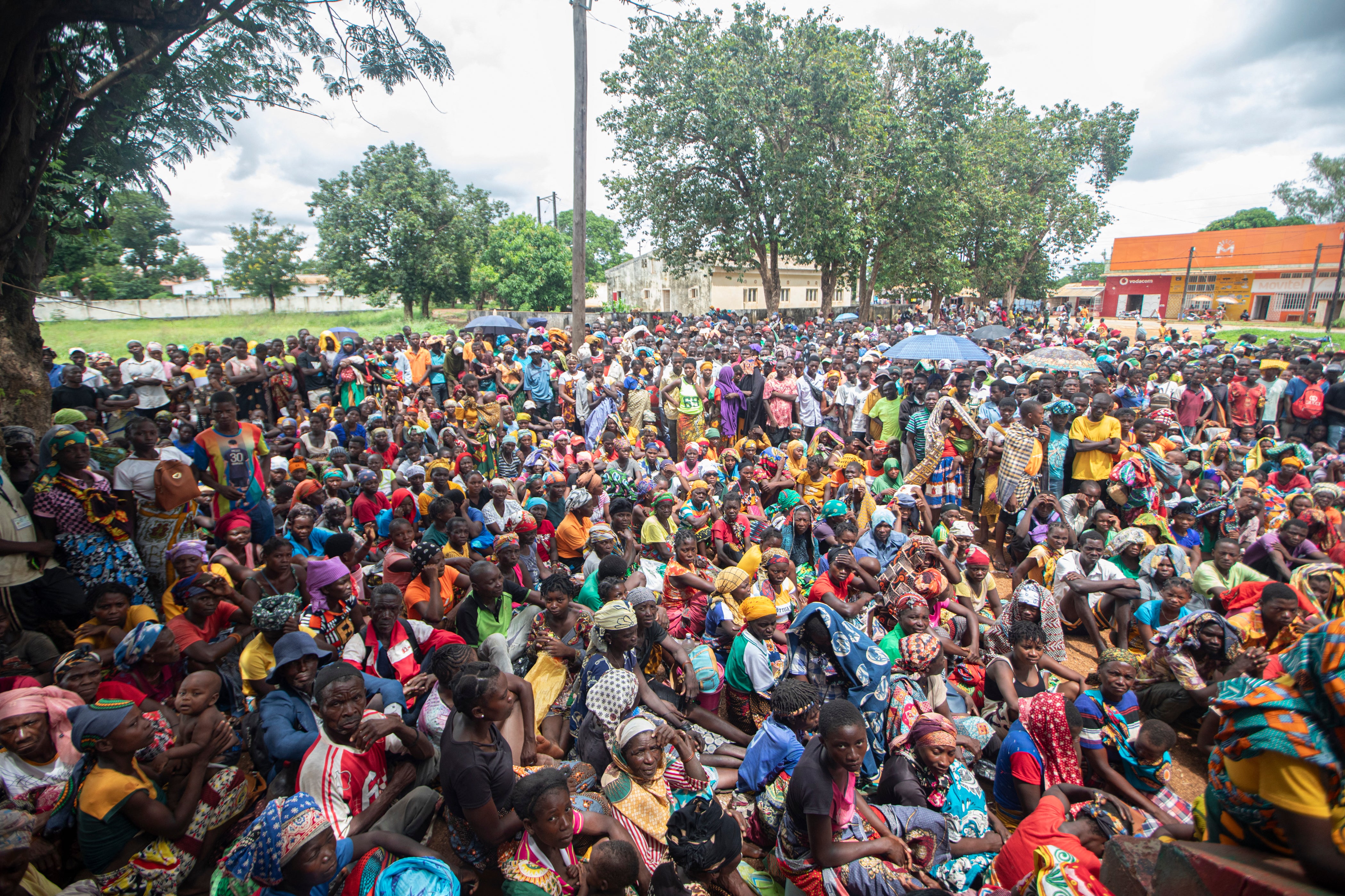 Displaced people gather to receive humanitarian aid in Namapa, Mozambique, in 2024