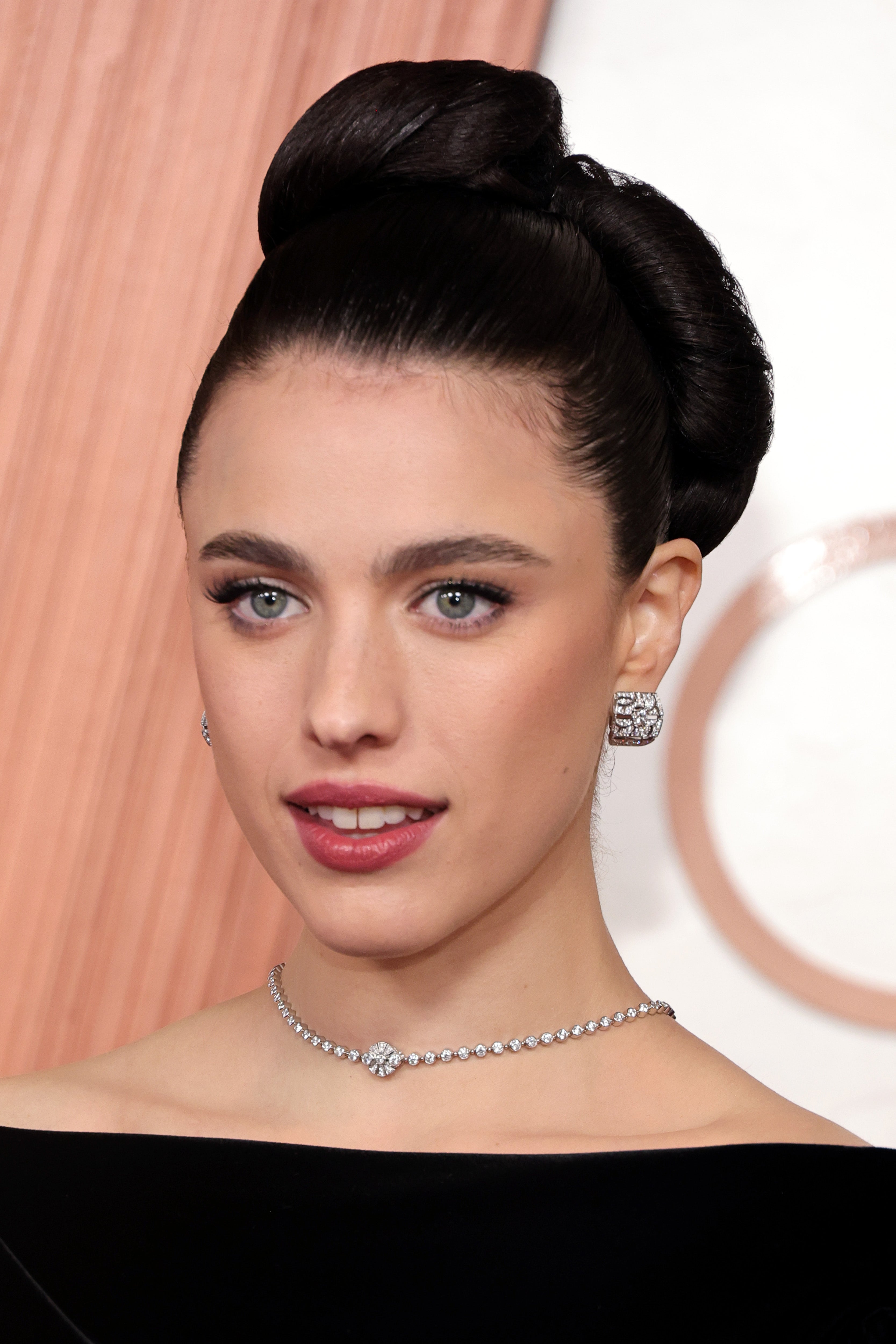 Qualley's hair stylist, Anna Cofone, executed a flawless, rolled up 'do on The Substance actress