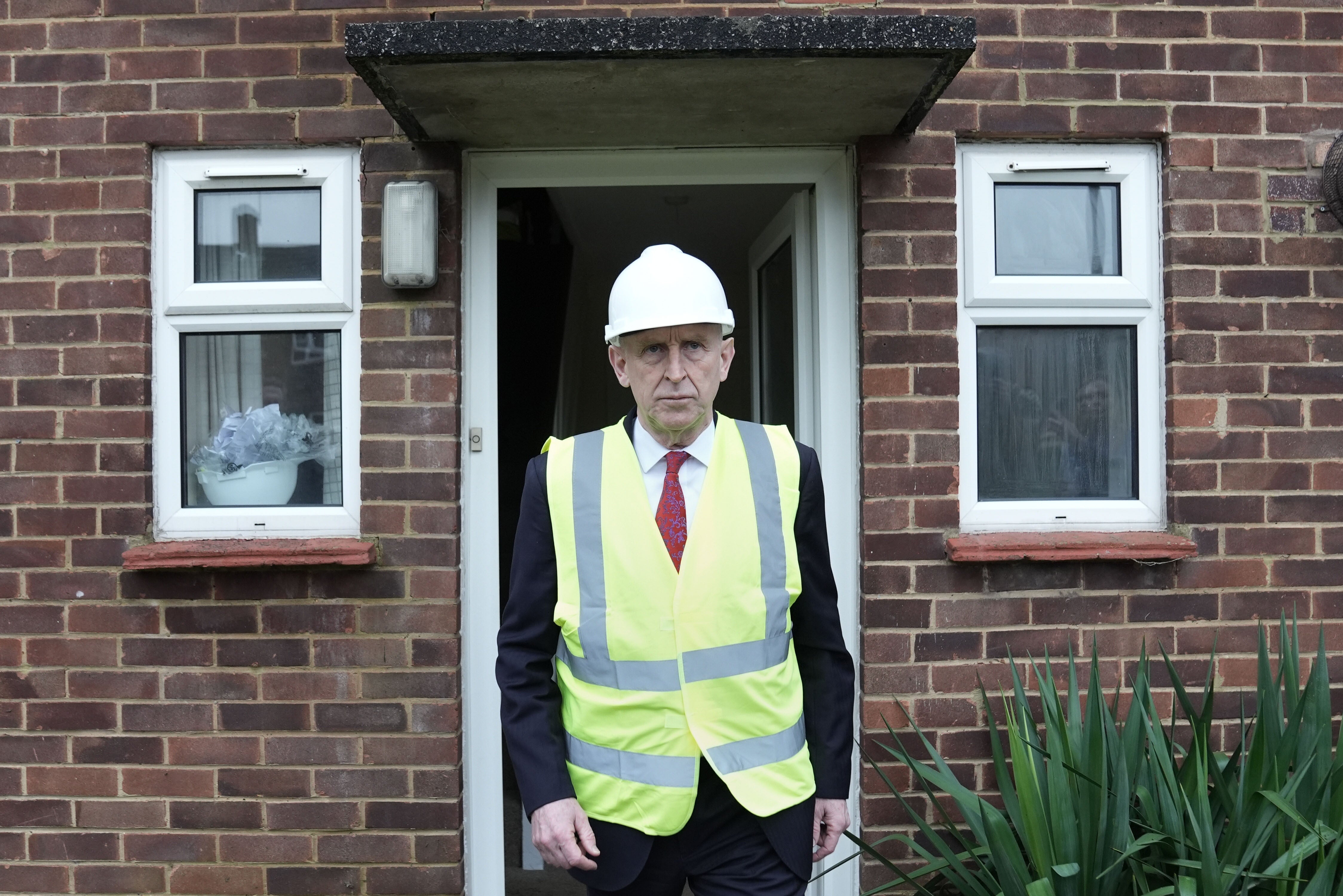 Defence Secretary John Healey during a previous visit to see military housing which is in disrepair, near RAF Northolt.