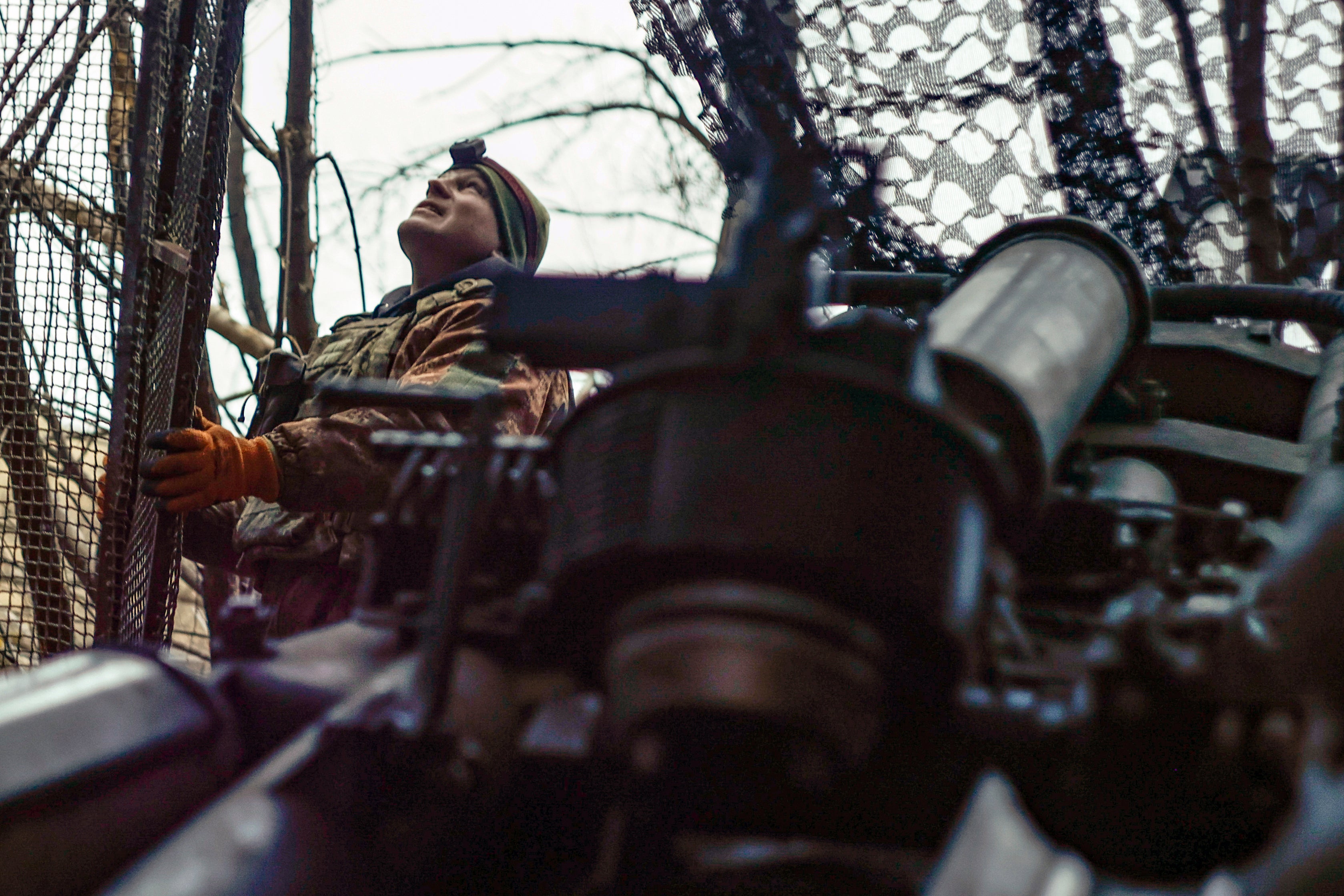 A Ukrainian soldier looks at the sky searching for Russian FPV drones near Donetsk.(AP Photo/Roman Chop)