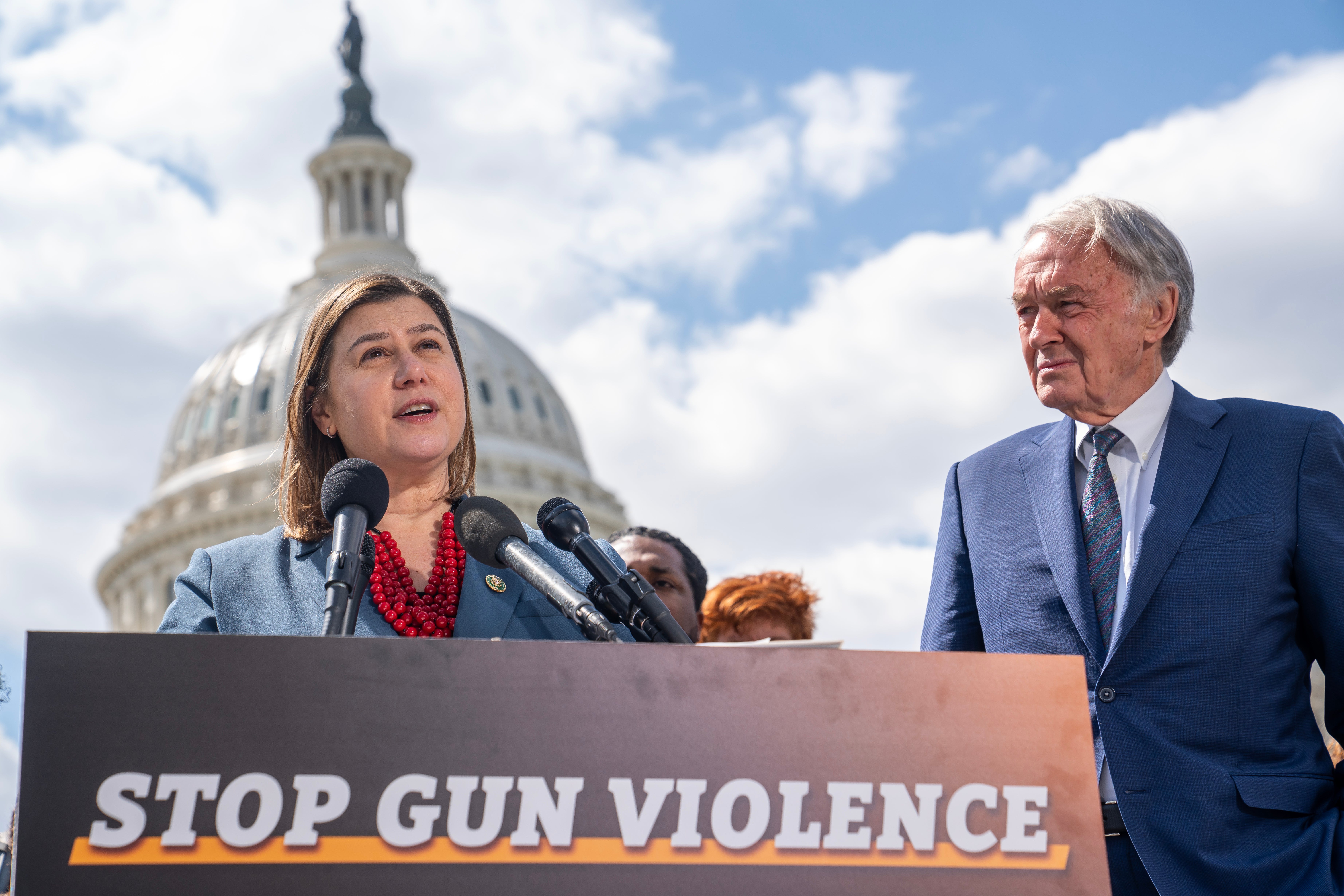 Slotkin pictured with Senator Edward Markey while advocating for further gun control research during a press conference in 2023