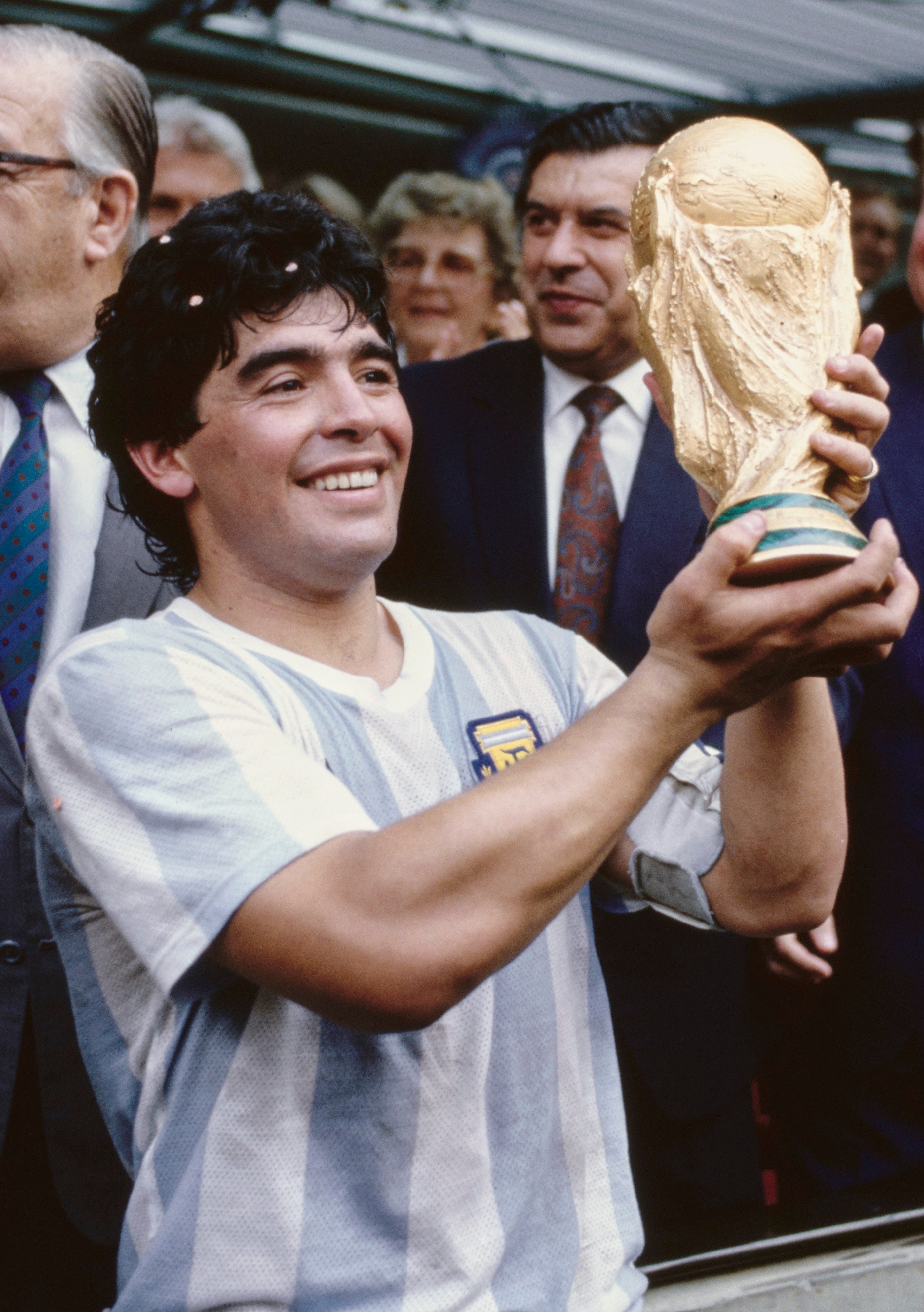 Maradona lifts the World Cup trophy after leading Argentina to victory, perhaps the crowning glory of his stunning career