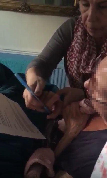 A court exhibit shows the scene as Margaret Baverstock’s alleged final will was made with her daughter Lisa Baverstock holding her hand