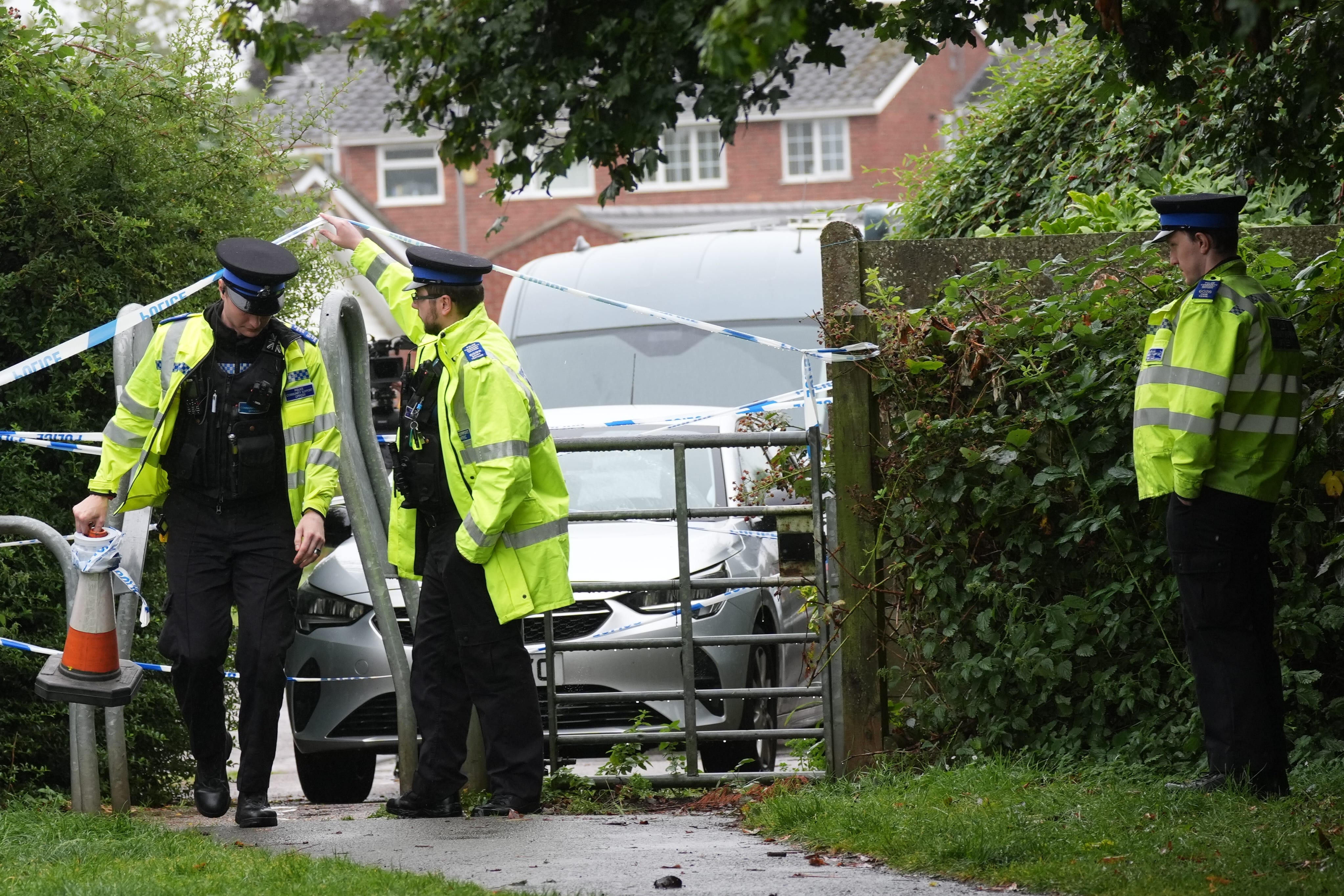 Police officers at the scene of the assault in Franklin Park, Leicester (Jacob King/PA)