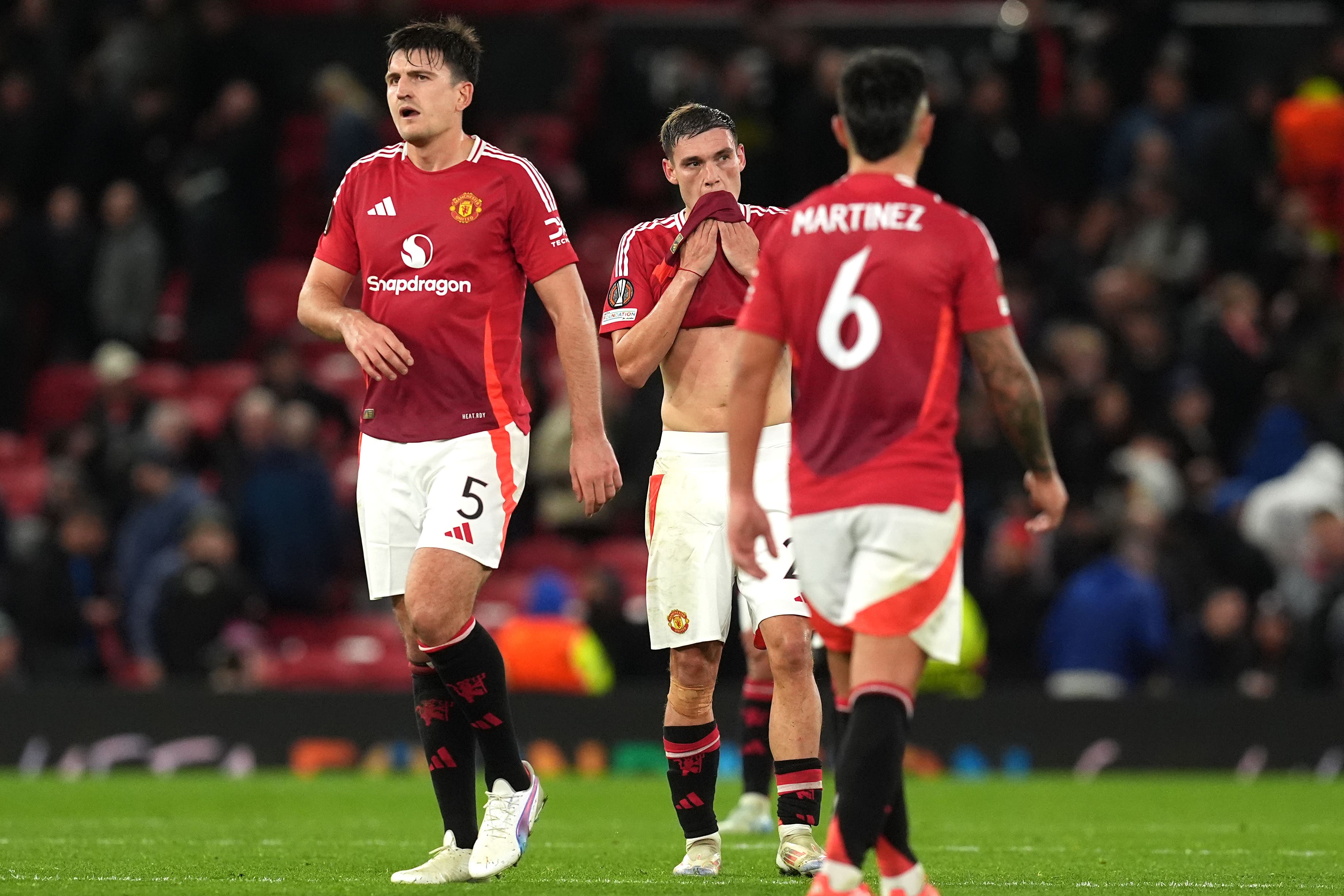 Manuel Ugarte (centre) and Harry Maguire (left) both remained at home as Manchester United flew to Spain for Thursday’s match against Real Sociedad (Martin Rickett/PA)
