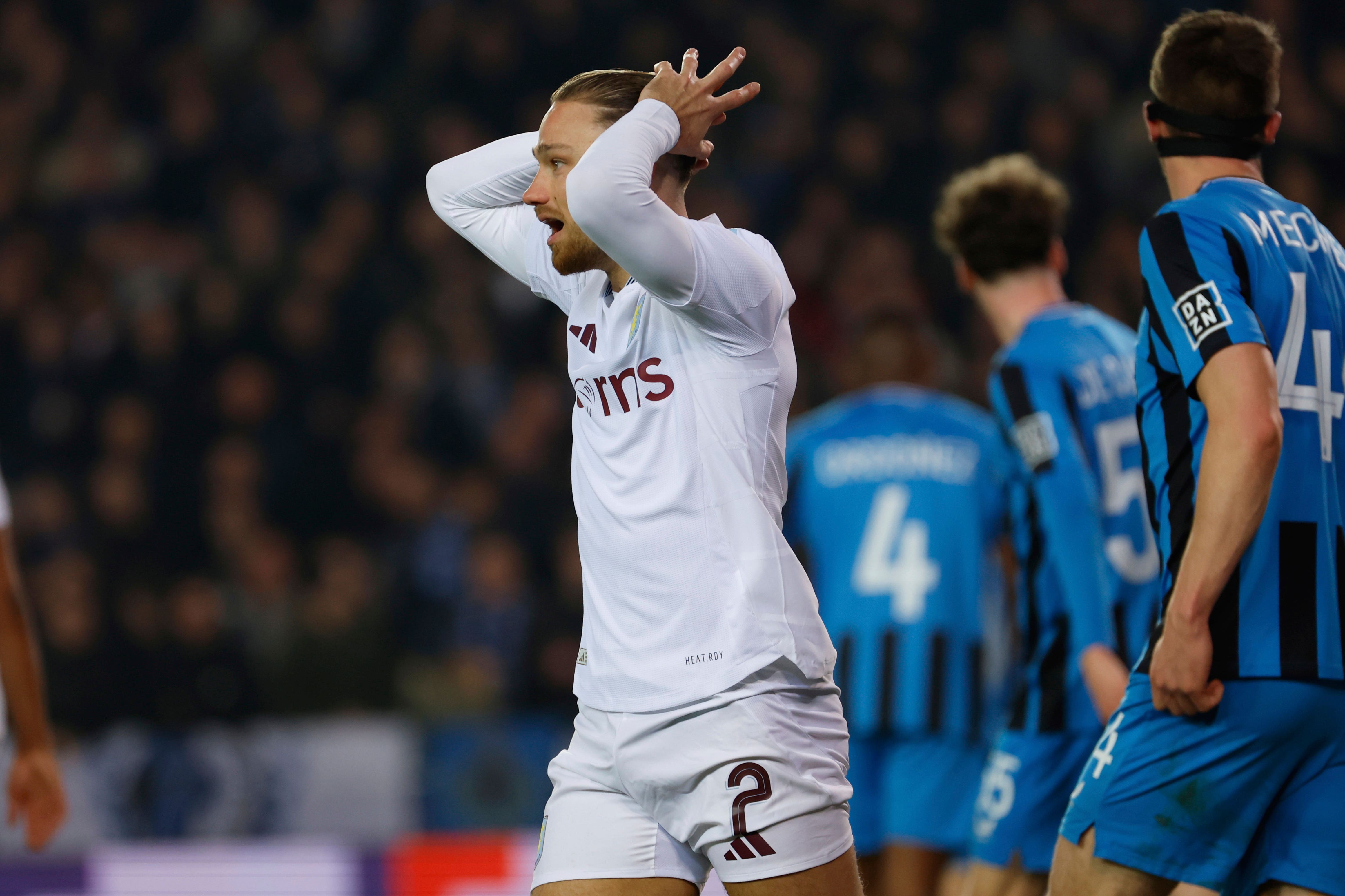 Aston Villa’s Matty Cash, center, reacts after a missed opportunity during the Champions League round of 16 first leg soccer match between Club Brugge and Aston Villa at the Jan Breydel Stadium in Bruges, Belgium, Tuesday, March 4, 2025. (AP Photo/Geert Vanden Wijngaert)