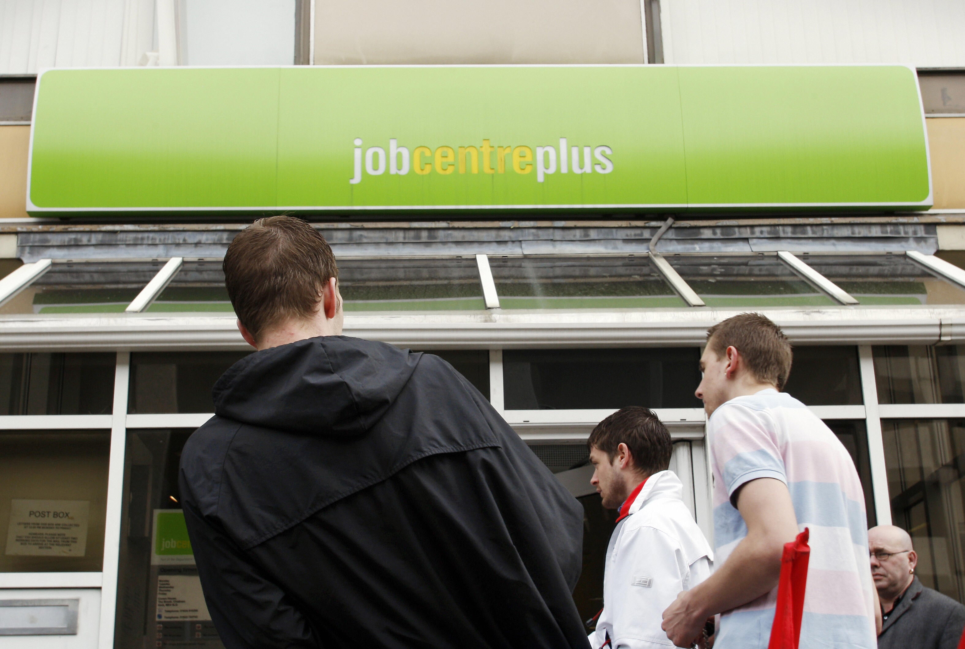People stand outside the Job Centre in Chatham