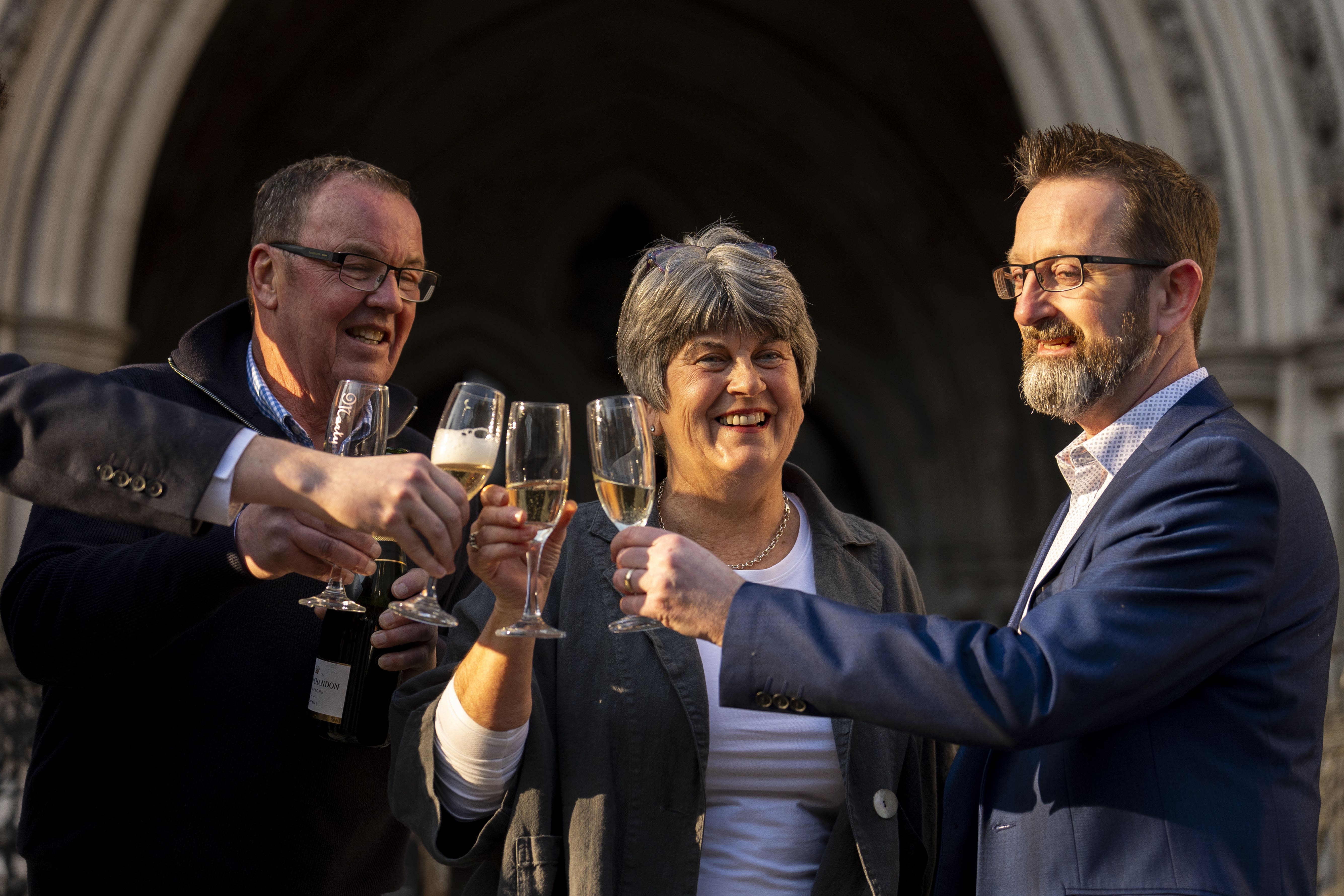 Corrine Durber with her husband Colin and solicitor Peter Coyle outside the Royal Courts of Justice