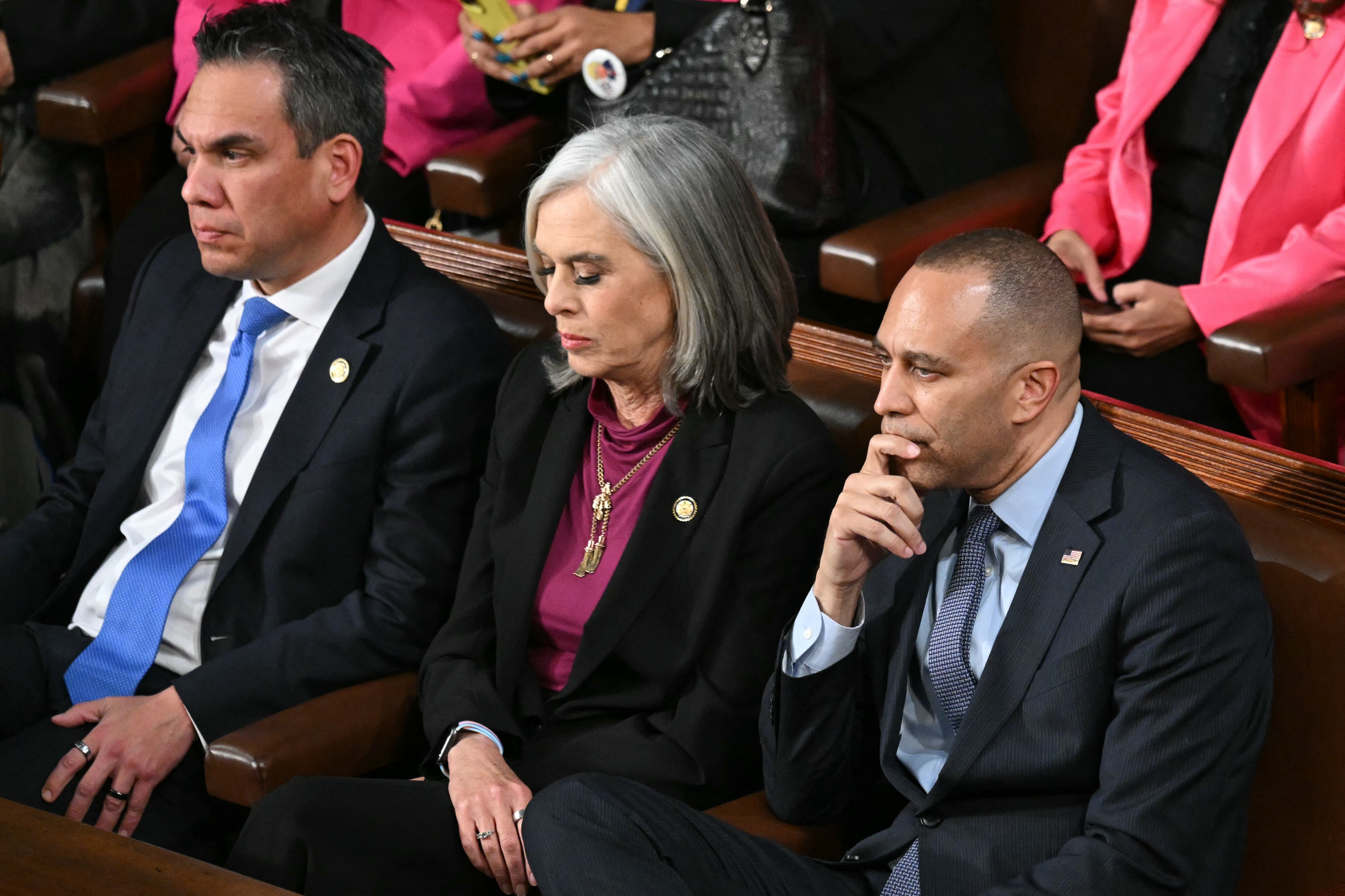 Members of House Democratic leadership including Katherine Clark, center, and Hakeem Jeffries, right, attend Donald Trump's State of the Union address.
