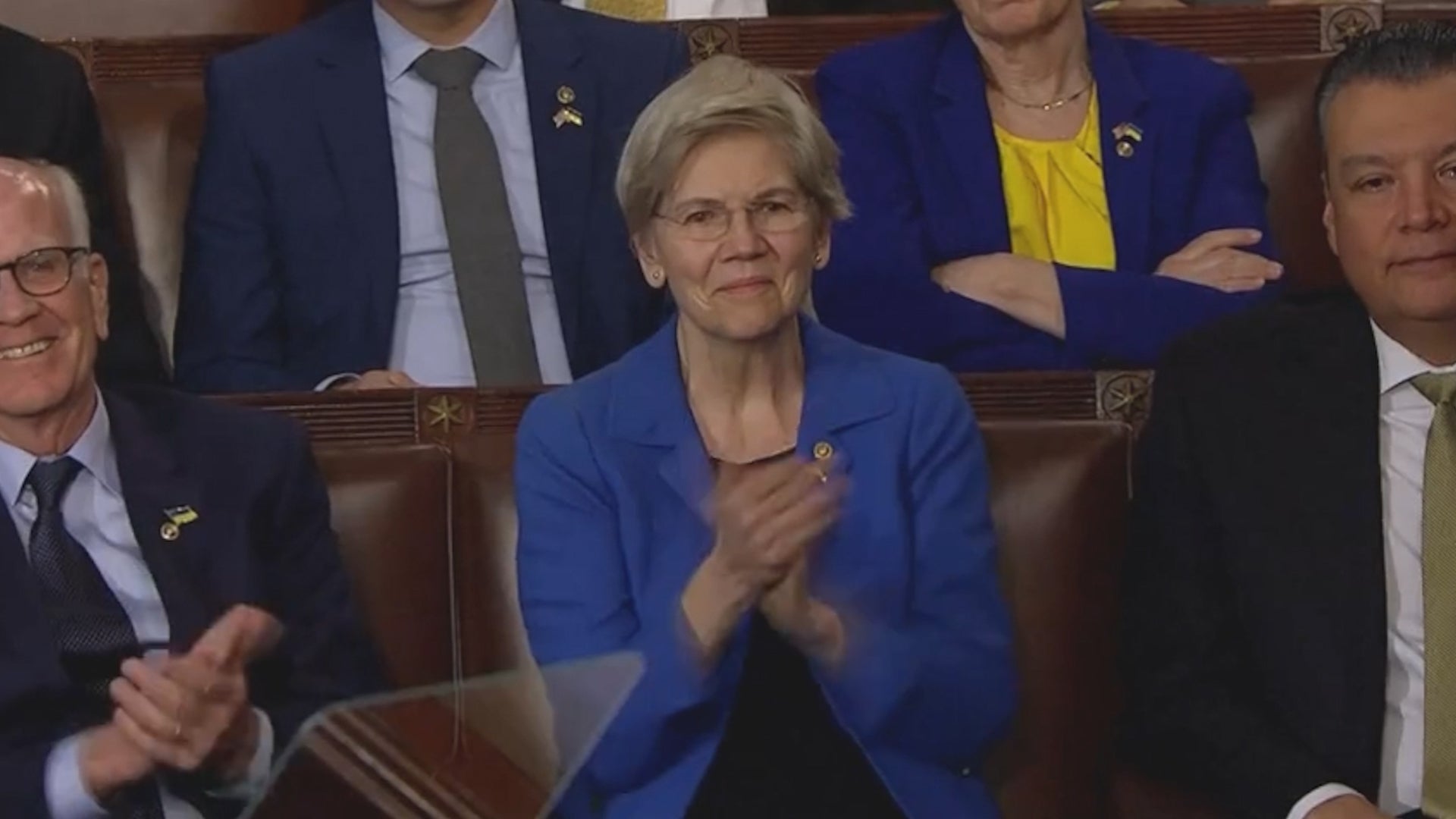 Elizabeth Warren sarcastically applauds as DonaldTrump insults her during his speech.