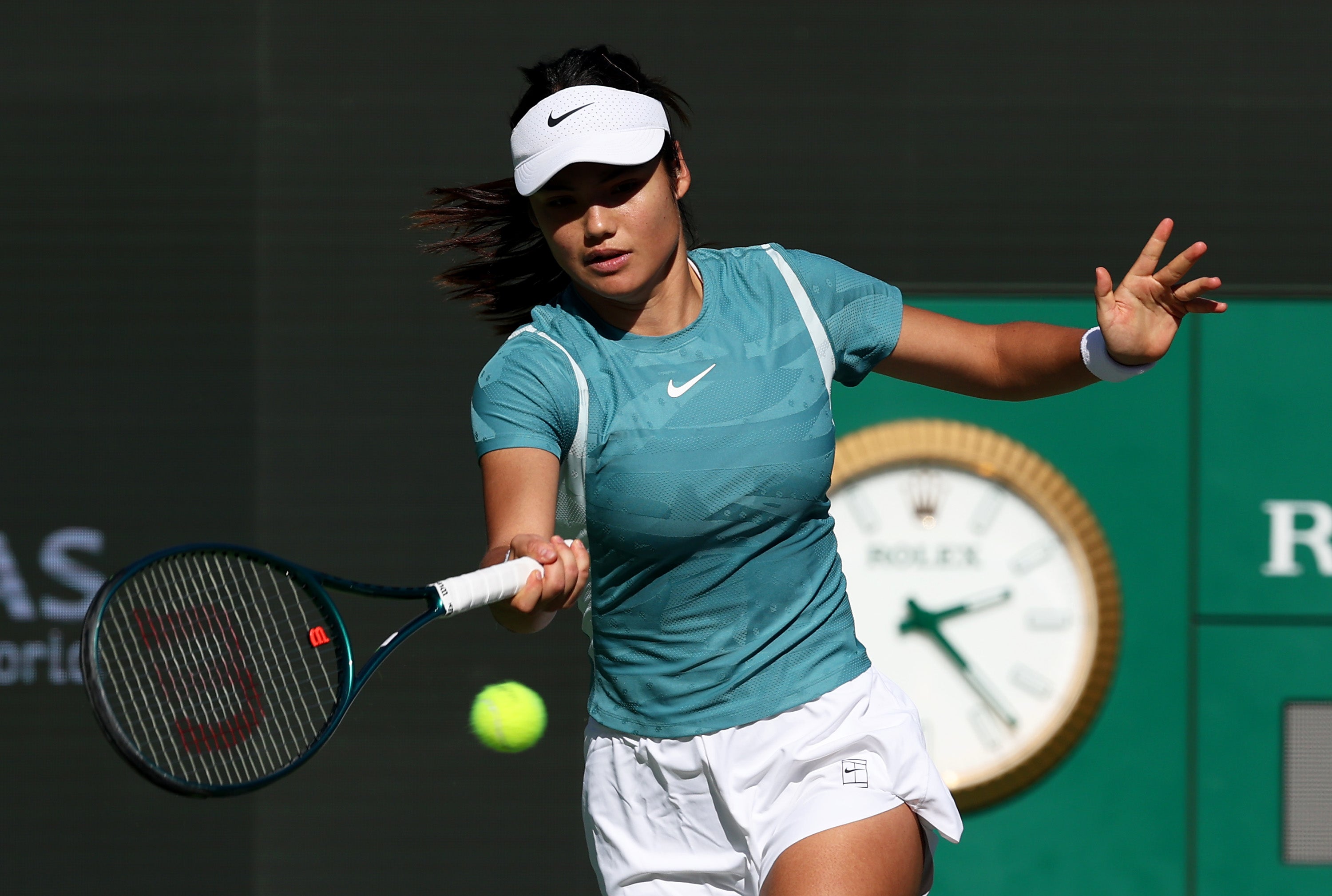 Emma Raducanu plays a forehand during practice at Indian Wells