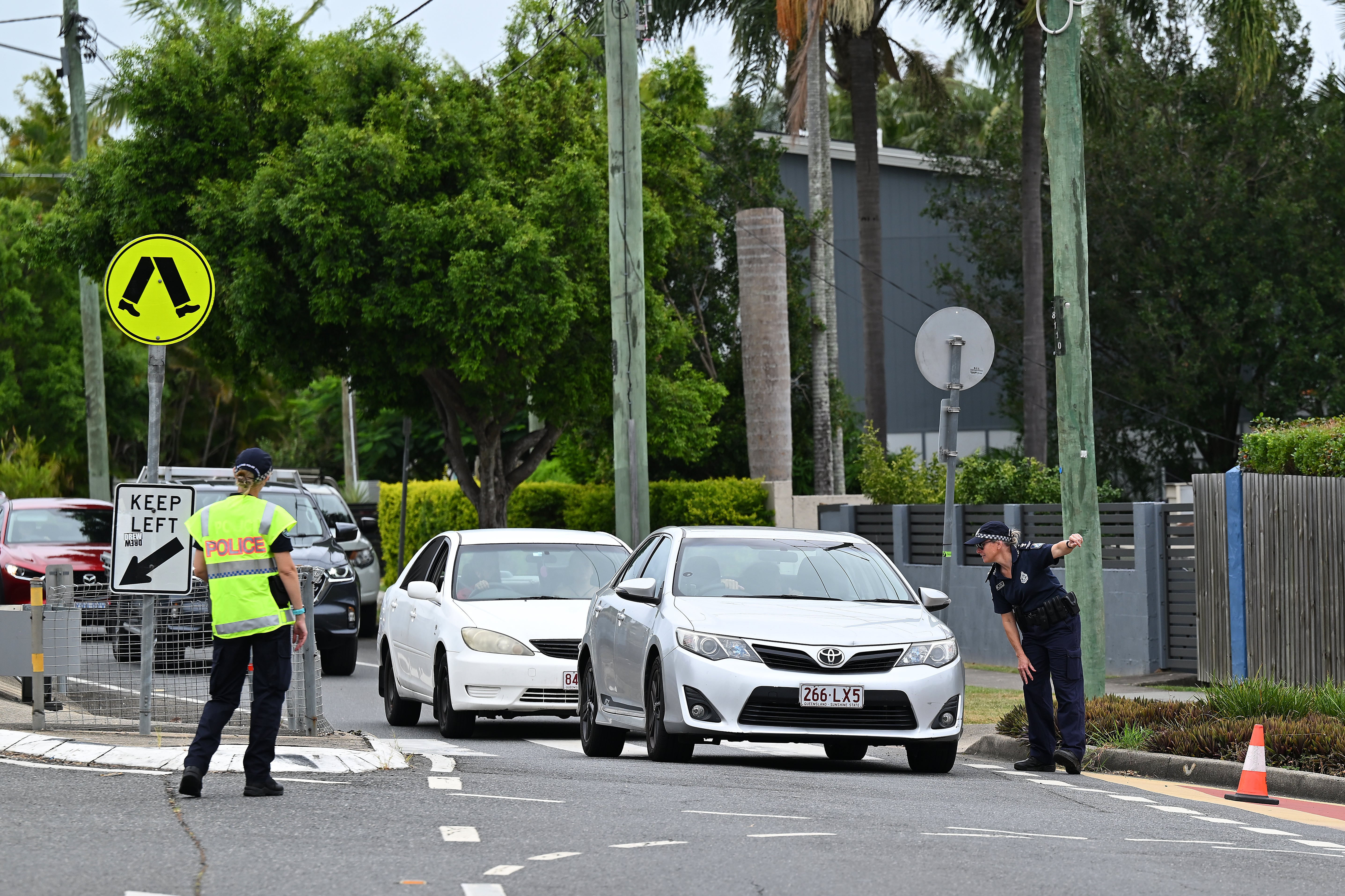 Police set up traffic control at a Newmarket sandbag depot in Brisbane, Australia