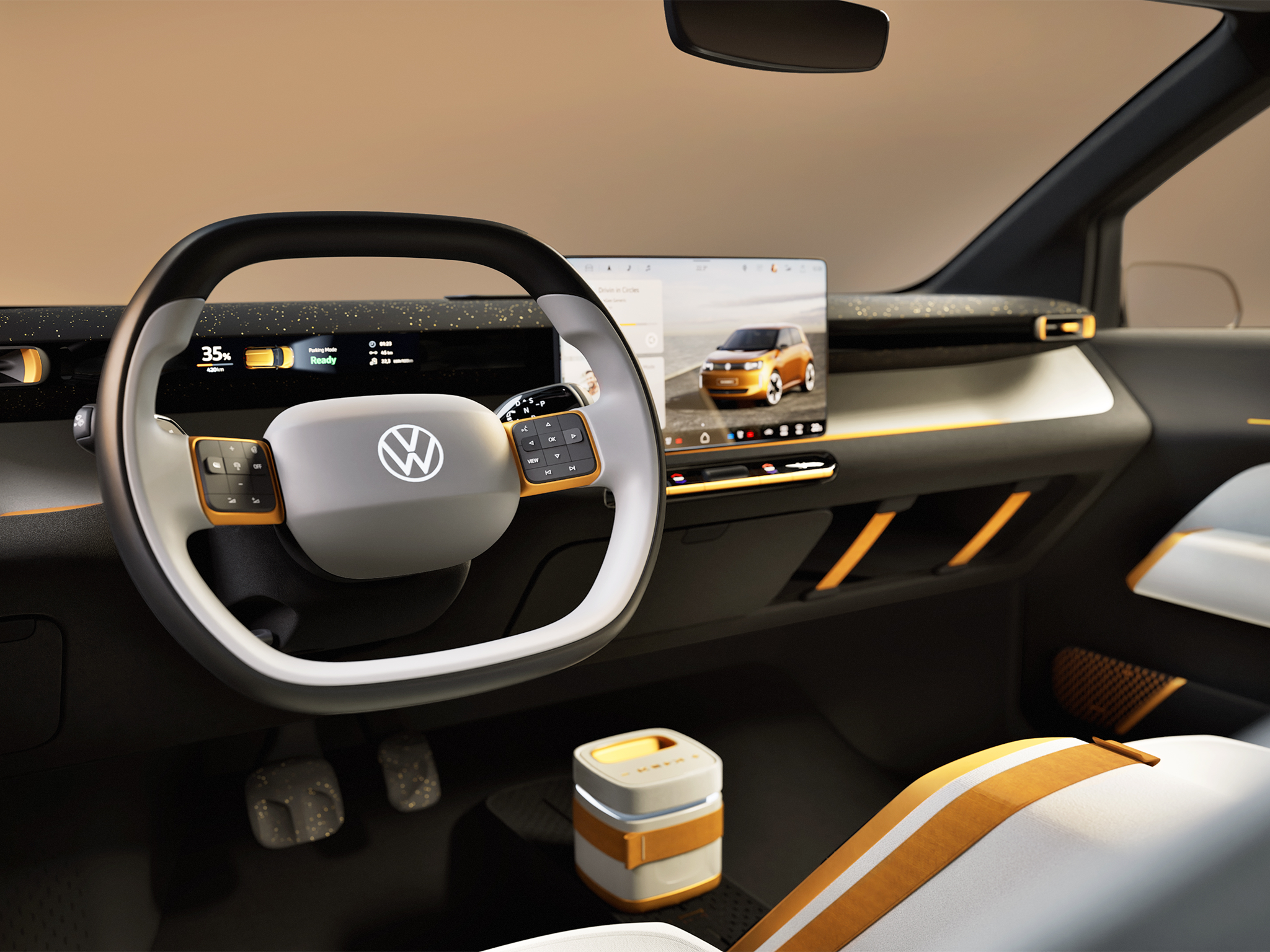 The steering wheel features proper buttons rather than touch-sensitive pads