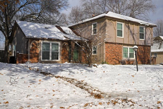<p>On January 9 last year, Kansas City Police were called to this home in the Northland section of Kansas City by a woman who claimed to have found a body in her backyard while looking for her fiance</p>