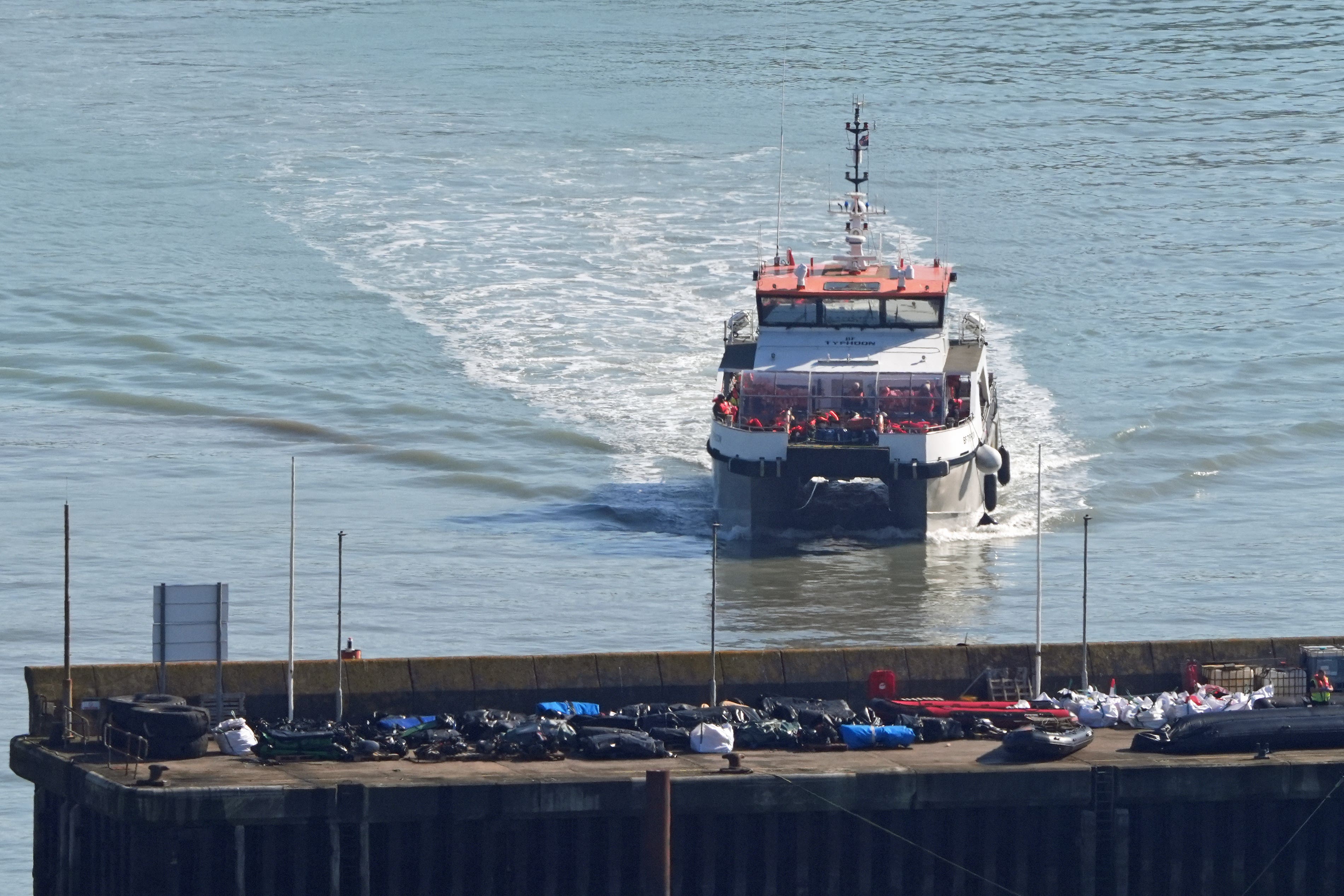 A group of people thought to be migrants are brought in to Dover, Kent, onboard a Border Force vessel following a small boat incident in the Channel (Gareth Fuller/PA)