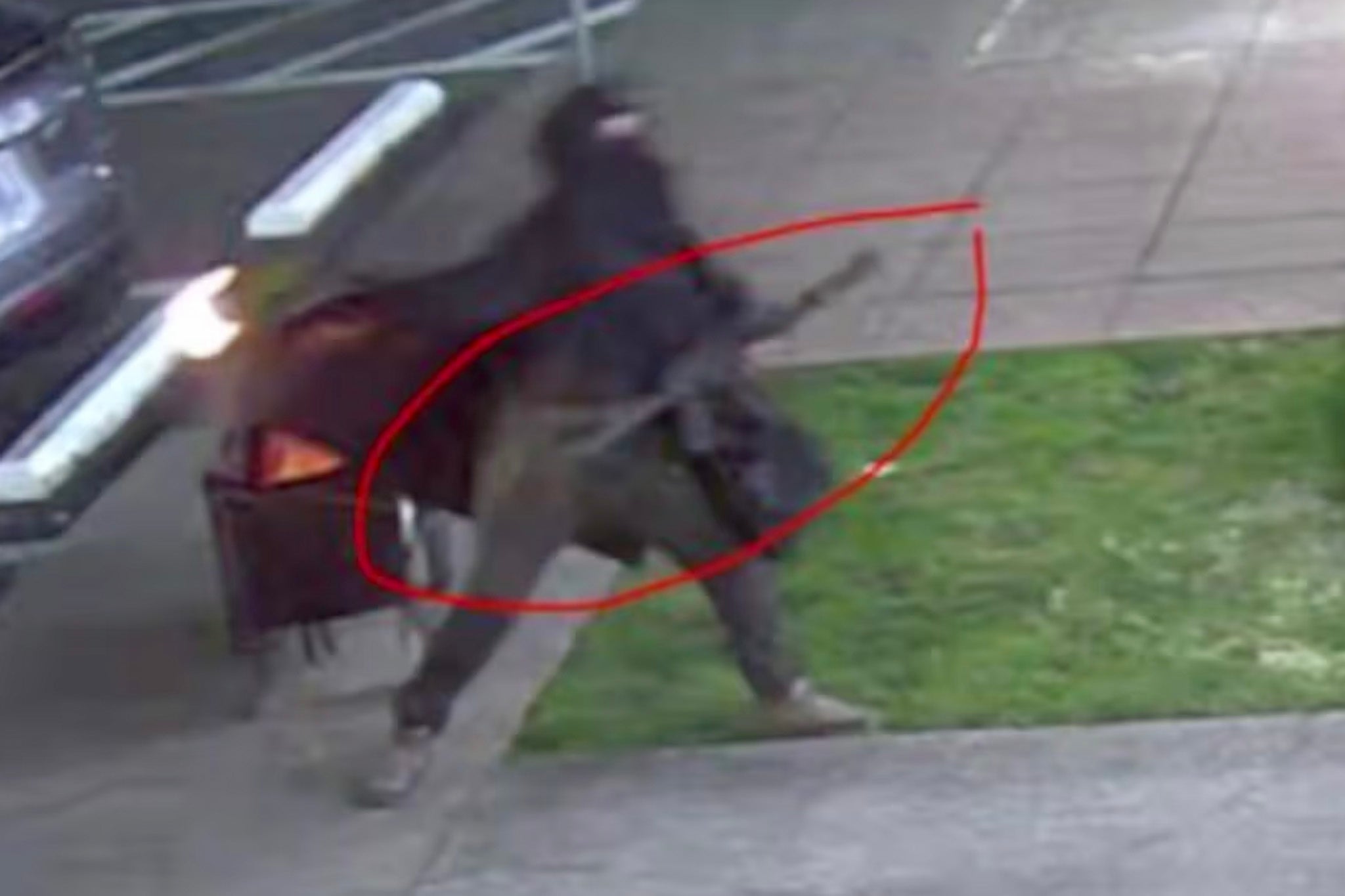 The assailant was pictured on CCTV surveillance launching the Molotovs