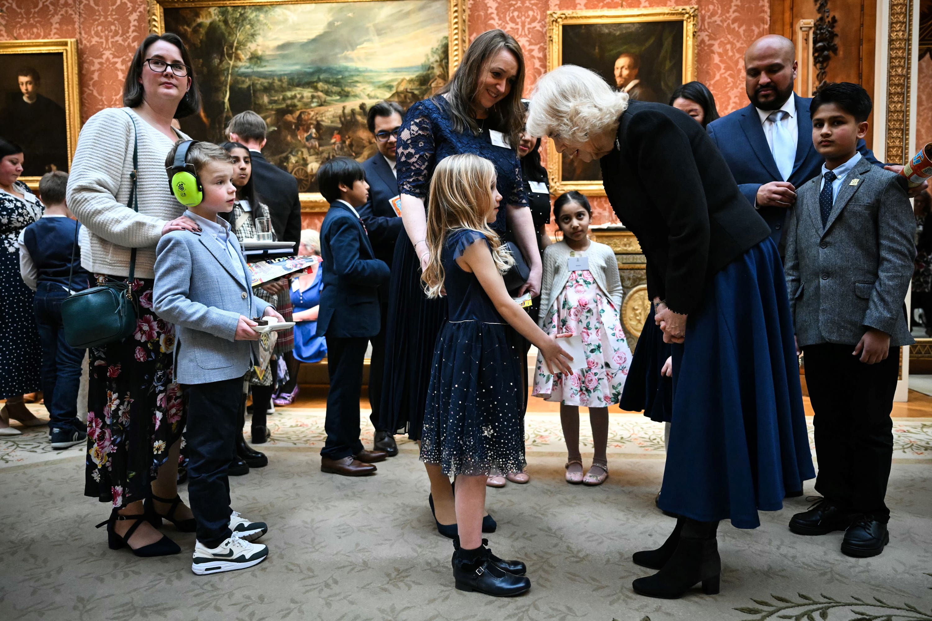 The Queen meets participants during a reception with finalists, judges and celebrity readers, to celebrate the final of BBC’s creative writing competition 500 Words (Justin Tallis/PA)