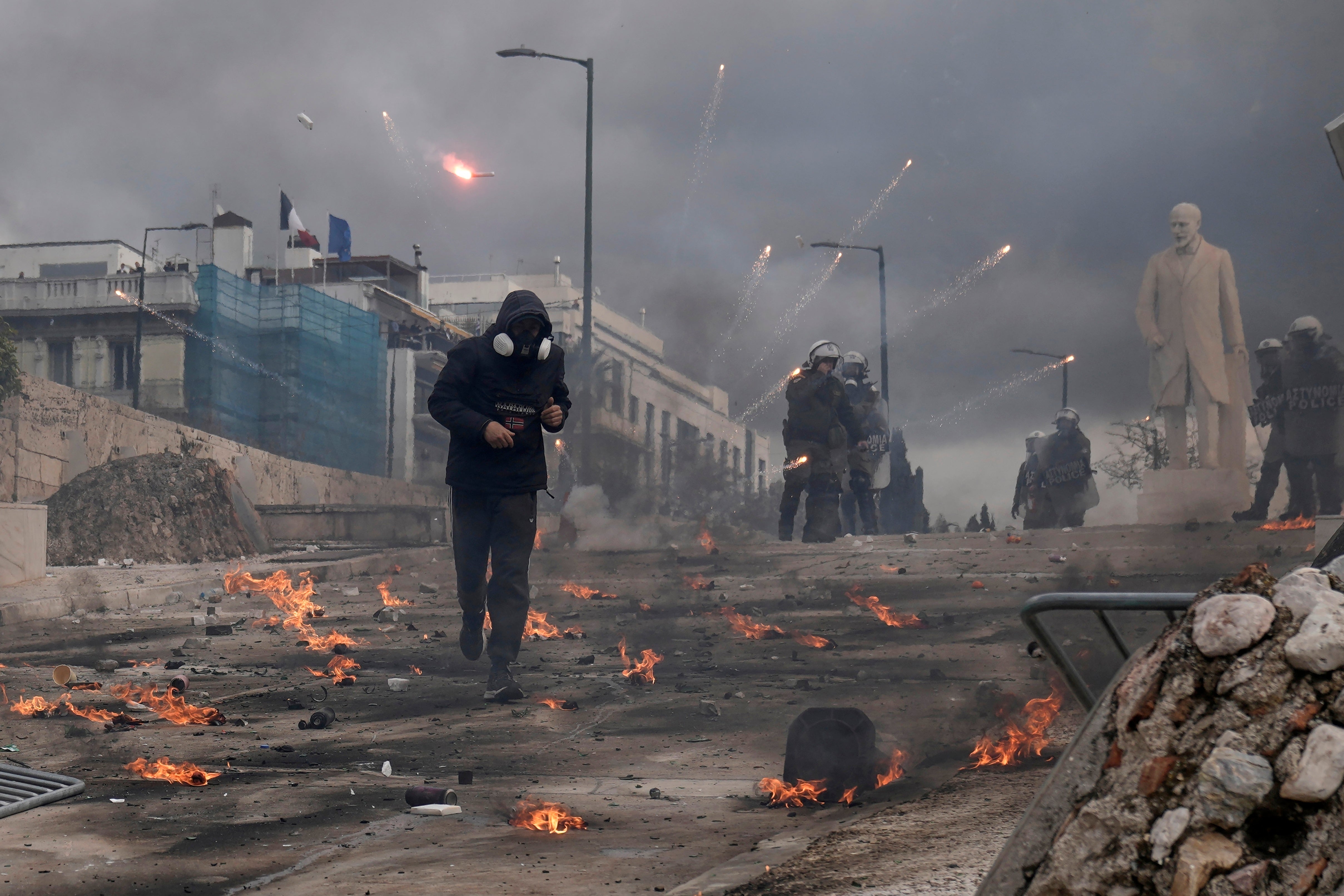 Athens has faced multiple protests on the second anniversary of a deadly rail disaster, including this outside parliament in February